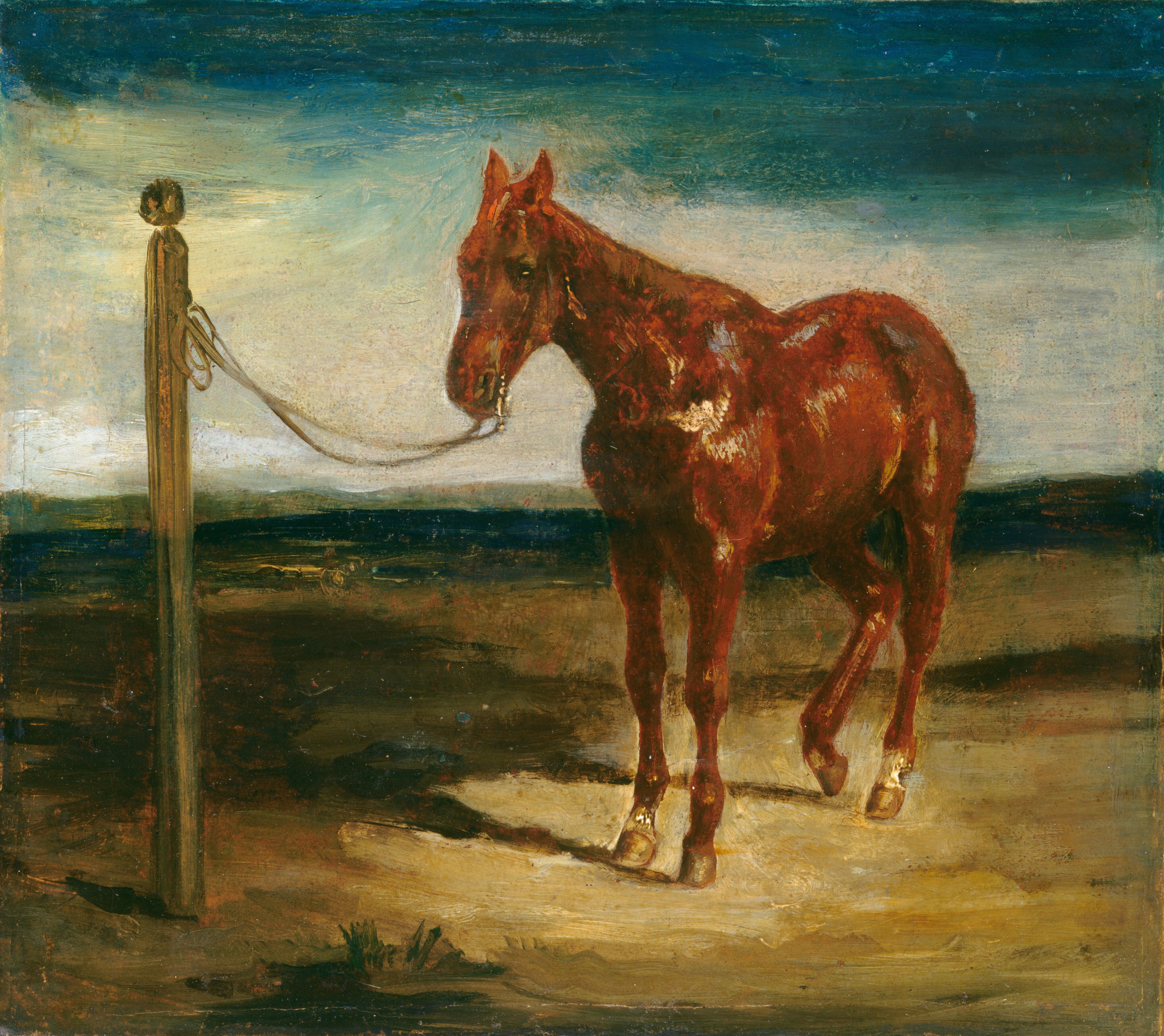 This is a painting of a red horse standing on a patch of tan ground, tethered by a rope to a tall brown post. The horse's reddish-brown coat is rich and glossy, with white highlights. It faces the left, with its ears pricked up. One of its back legs is slightly raised. The ground behind the horse is flat, with patches of yellow ochre, brown, and dark green. The sky above is a mix of blue tones, with light blue near the horizon and darker blue-green at the top of the painting. The brushstrokes in the painting are thick and visible.