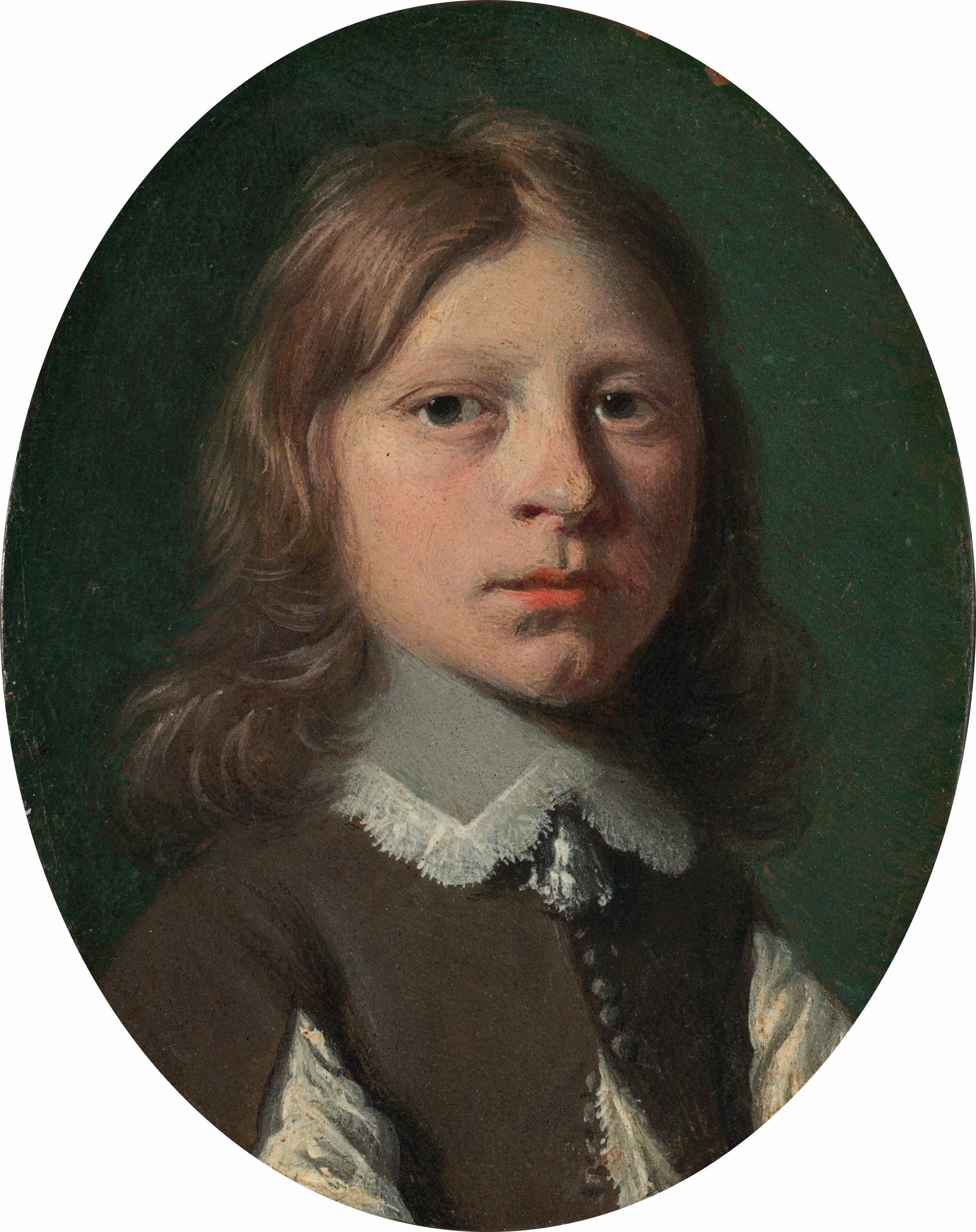 The head and shoulders of a young, pale-skinned boy fill this oval portrait painting. His shoulders are angled to our right, but he turns his face to look at us out of the corners of his large, dark blue eyes. His round cheeks and nose are slightly flushed, and his full, pink lips are closed over a cleft chin. His wavy brown hair falls to his shoulders and around his high, lace-edged collar. The boy’s brown doublet has small buttons down the front, which falls open over a linen shirt. His sleeves are also slit almost up to the shoulders to reveal linen there, too. Light from high to our left falls across the boy’s face and casts the ocean-green background into shadow.