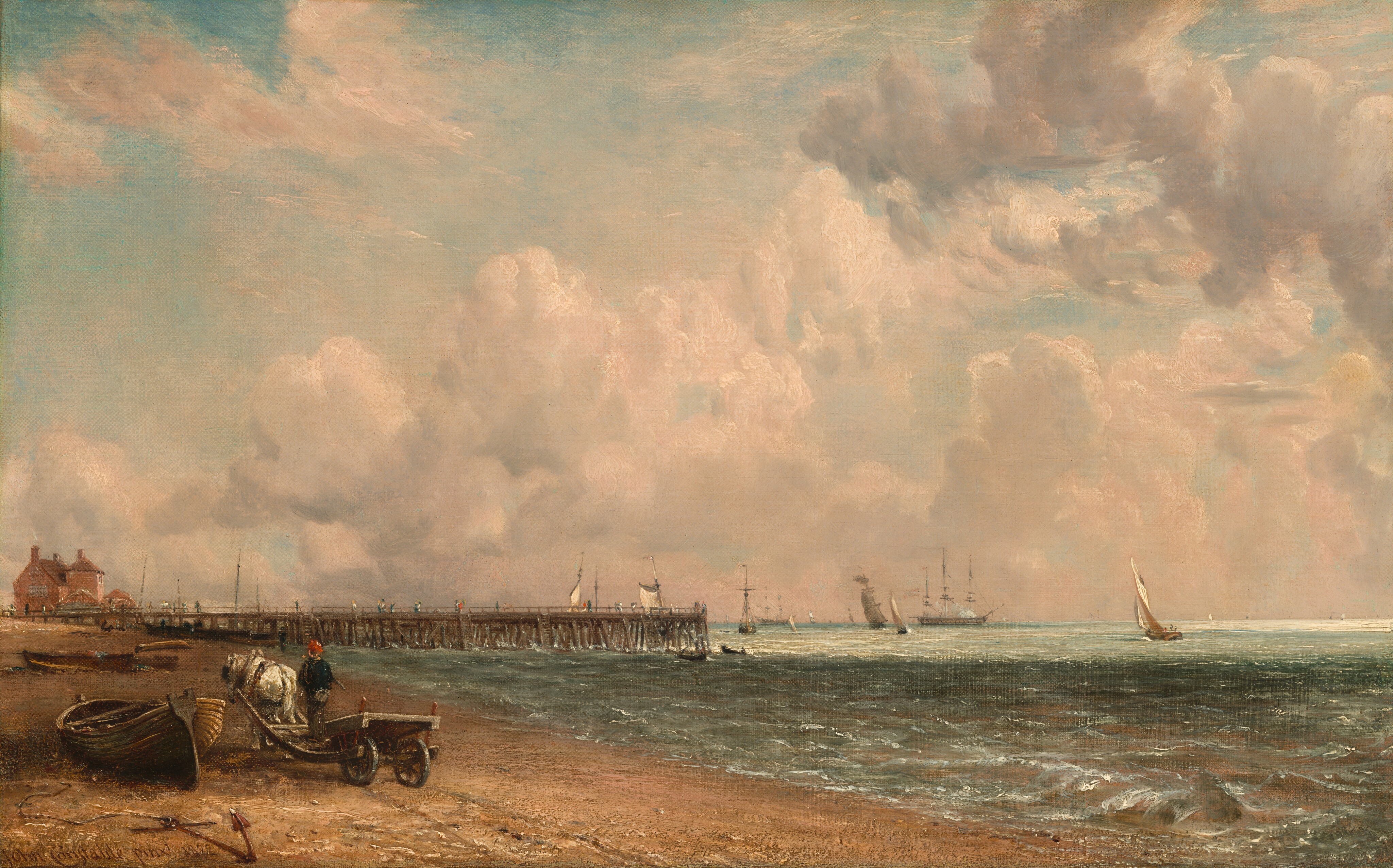 This painting shows a seaside view with a low horizon.  A sandy beach is on the left, with ships and sailboats sailing on the water in the distance on the right. From the beach on the left, a pier in the distance extends into the water, with people walking on it. There is a pink building on the beach near the end of the pier. Closer to us, near the bottom left corner, is a white horse tied to a cart with a person standing on it. The horse and person both face away from us, heading towards the pier. They are passing by a small wooden boat that lies in the sand on their left, connected by a rope to a dark red anchor submerged in the sand. The brushstrokes are smooth and detailed in the sky and sea. The color palette is dominated by pastel tones of beige, blue, and grey. The water is greenish-blue, with darker areas of shadow and light areas in the distance. The sky is blue, full of puffy white clouds that are tinged with light pink.