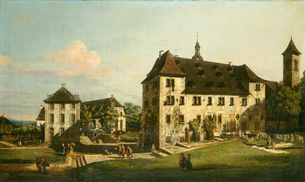 The painting depicts a stately building complex from an elevated point. The buildings are large, with white, ivy-covered walls and dark, peaked roofs. One building on the left is directly ahead of us, while a closer building on the right sits on a small hill. The buildings are connected by wide gray paths and small stairs. Small people walk the paths or stand on the surrounding grass wearing dresses or suits in bright colors, some with white wigs or pointed hats. The light is warm, and the people cast soft shadows on the grass. Tall trees near the buildings provide areas of shade. The sky above is soft blue with pale white clouds.