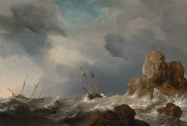 Amid the white crests of gray, churning waves, two masted ships tip wildly near a rocky outcropping beneath slate-gray and lavender-purple clouds in this horizontal landscape painting. The horizon comes a quarter of the way up the painting, and the ships are outlined against the clouds, which sweep across the sky from the lower right to the upper left corner. A patch of topaz-blue sky shines through at the top center of the painting. The long side of the three-masted ship to our left faces us and flags, possibly white with red stripes, fly from two of its masts. The ship at the center of the painting is angled toward us and a single white flag with a red cross flies from one of its two masts. Tiny in scale, people are gathered on the decks and climb the rigging alongside the masts. On the boat at the center, one person hovers overboard, perhaps holding onto a rope or shown falling to the sea. Foamy waves lap at the tall, jagged rock formations to our right, which jut out of the ocean like teeth. The largest boulder, near the right edge of the painting, is painted with tones of golden tan and silvery gray, suggesting it catches sunlight. The lower rocks, closer to us, are in shadow and painted coffee brown and iron gray. Upon closer inspection, two people climb onto the jagged rock closest to us. More scrutiny reveals several people in a rowboat and two men in the water around the rocks. A few birds, minuscule against the waves, fly over the rocks.
