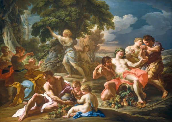 Nine men and women and three pudgy, toddler-aged children gather in small groups under a copse of trees against a deep landscape in this horizontal painting. Most of the people have pale, nearly white skin and a few have darker, peach-toned skin. They all have rosy cheeks, and most have strawberry or honey blond hair. The men and women wear loose robes in shades of topaz and ice blue, vibrant peach, pale pink, or harvest yellow, and the children appear to be nude. Light pours across the scene from the left. Two women sit in the lower left corner of the composition, mostly in shadow presumably created by trees outside our view. One leans toward us holding a tray of fruit with her dress nearly exposing her round breasts. A woman sitting closer to us holds up a fig as a child reaches for the fruit. Closer to us, a muscular man sits on the ground next to an urn the size of a backpack. One child next to the urn sits almost with their back as he holds up a cup, and a gold-colored horn hangs from a ribbon across the torso. Another child other leans forward closer to the man, a bunch of grapes held in both hands. A pile of grape vines with grapes and orange-colored fruit sits between the man and first child. Behind this trio, one woman picks fruit from a leafy tree, which has a grape vine growing around its thick trunk. Another woman sits in the shade of the tree and looks on, a piece of fruit in her hand. The final four people are gathered to the right, where one man supports another who leans limply away from us, one arm slung over his supporter’s shoulders. The partially prone man is bare-chested and wears a crown of grapevine leaves. More leaves are around his waist under a vivid, coral-red cloth, and his feet rest on a pile of figs, fruit, and grapes. A third man in this trio is the only one with a beard. He wears a cheetah animal skin and presses grapes in both hands to fill the cup held by the prone man. A woman stands between the pair, holding more grapes and looking off into the distance. Trees and bushes grow across the left half of the composition, and a distant landscape on the right half opens onto rolling hills and hazy mountains. The sky glows peach along the horizon and deepens to twilight blue across the top half of the painting.