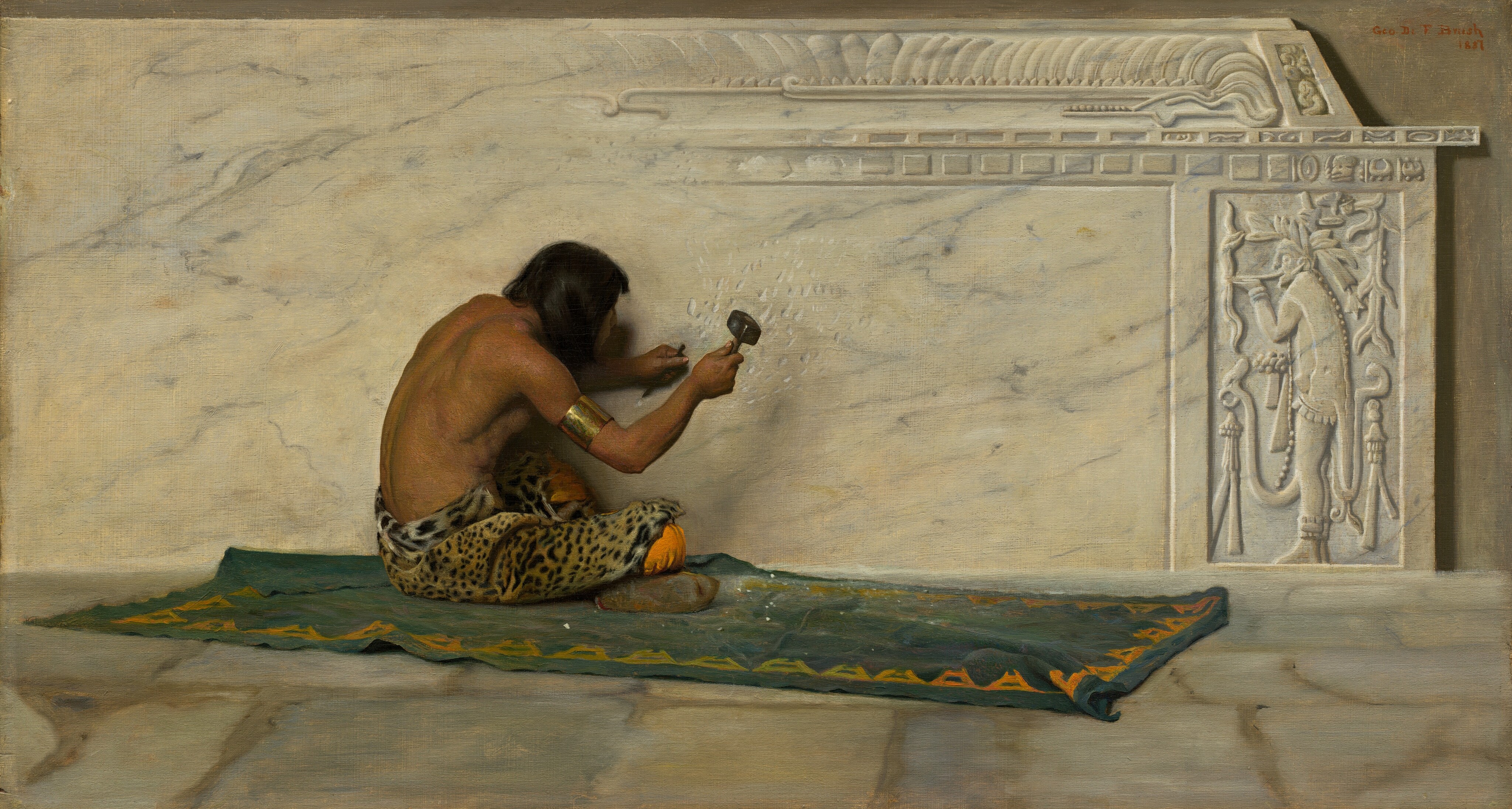 This painting shows the back view of a person sitting cross-legged on a blue-green mat or rug with yellow details, carving a large slab of white stone with gray marbling. The person has light brown skin and dark, straight hair, and they are wearing a gold arm band and a leopard print garment wrapped around their waist over what looks like orange pants visible at their knees. They hold a small chisel and hammer, and are carving small lines into the flat stone. The right and top edges of the stone slab have intricate patterns and designs, including the outline of a standing person wearing a feathered headdress, vines, animals, and geometric patterns. The floor below the person is more white marble, and the wall behind the slab is gray. The inscription "Geo. D. F. Brush" and the date "1881" are visible in the right corner.