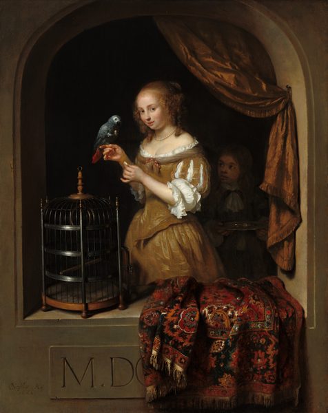 Shown from about the knees up, a pale-skinned young woman stands within a stone niche, with a parrot perched on her finger as she gazes out at us in this vertical painting. The woman’s hands are raised to chest height, and she balances the spruce-blue parrot on the index finger of her far hand while her other hand holds an indistinct, white object. Her body is angled to our left, and she looks at us from the corner of her green eyes under faint brows. Her round face has a small nose, flushed cheeks, and her coral-red mouth curls up in a slight smile, her lips parted. Her honey-blond hair is gathered at the back of her head with curly tendrils framing her face and falling to her shoulders. She wears a golden-brown gown trimmed with a narrow ruffle of white fabric along the low neckline that reveals her décolletage. The bird faces the woman and lifts something, presumably a bit of food, up with one dark claw. The underside of its tail is crimson red. A light-skinned boy stands in deep shadow just to the right of the woman. He looks up at her and holds a silver tray in both hands. They stand within a light brown, arched, stone opening beyond a ledge, which comes up to about the woman’s knees. A carpet patterned with stylized flowers in ruby red, burnt orange, teal blue, white, and black is bunched up and draped over the parapet, to our right. A tall, iron-gray cage sits to our left. The rug partly covers an inscription on the front face of the niche that reads, “M. DO,” with the O cut off. A copper-colored, fringe-lined drapery hangs from the upper right of the arch and is fastened to the inner edge of the opening to create a swag. The woman is brightly lit from the upper left, and the space behind her and the boy is ink black. The artist signed and dated the lower left corner as if he had carved into the front face of the arch. It reads, “CNetscher .Ao. 16.66,” with the C and N overlapping to make a monogram.