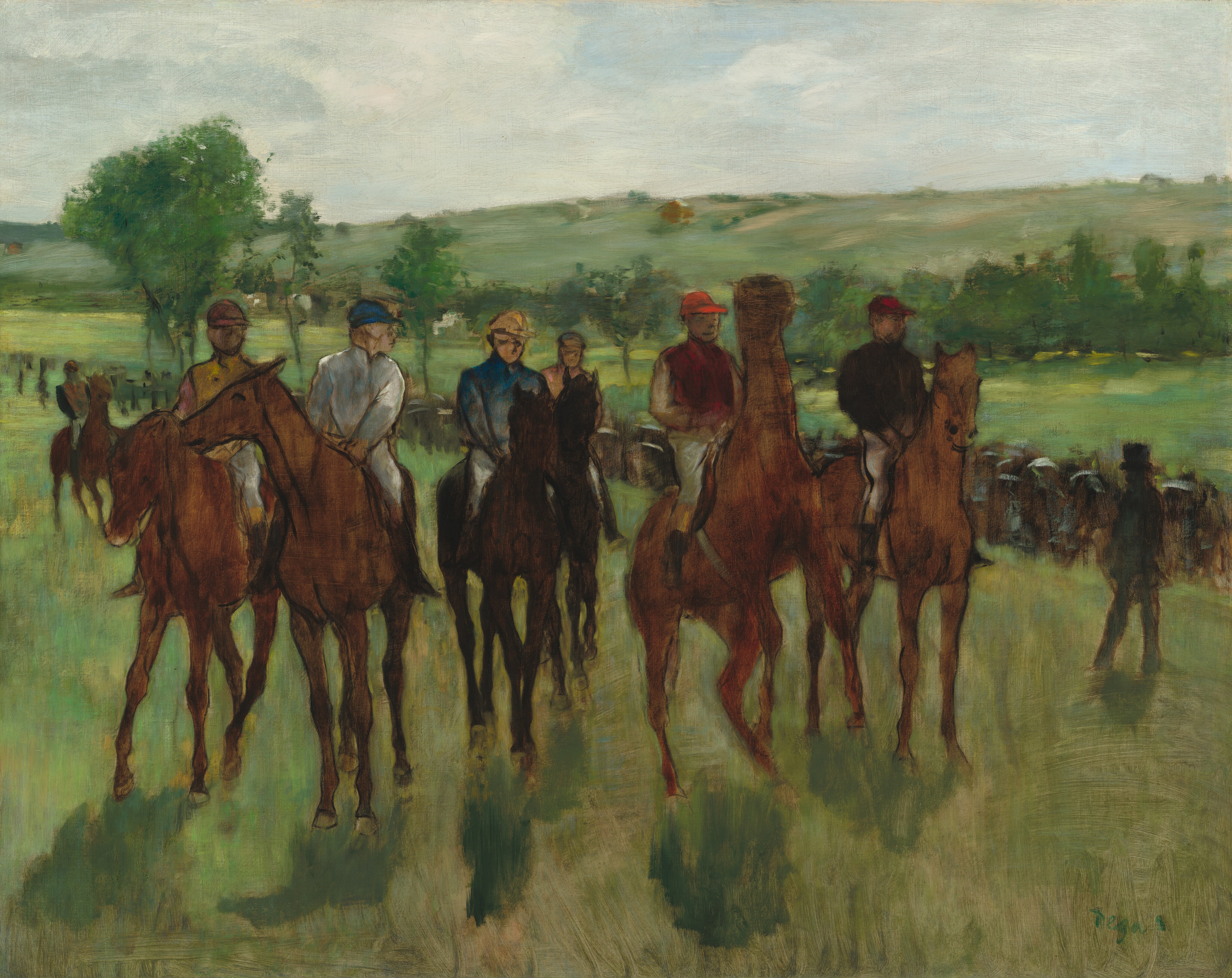 Six men on horseback and wearing jockeys’ uniforms line up on a grassy field in front of us in this loosely painted horizontal scene. The jockeys and horses’ features are especially freely painted so much of the detail is indistinct. The horses are all chestnut brown except for two at the middle, which are dark brown. One horse, second from our right, rears up on its hind legs, and one to our left nuzzles its neighbor. The riders all wear brimmed caps or helmets, white pants, and knee-high black boots. Their caps and high-necked shirts are painted in shades of goldenrod yellow, aquamarine blue, white, red, or peach. Their faces and hands are peach-colored or light brown. Some of the horses and the rider’s clothing are outlined in black. One of the riders is set a little farther back than the others. A black silhouette in the near distance to our right suggests a man wearing a suit and tall top hat. Swipes of black, brown, sky blue, and white create the impression of a crowd across from us, gathered on the far side of the grassy area. Light green fields continue back to a line of shamrock-green trees at the foot of gently sloping hills. White clouds screen the ice-blue sky above, which takes up the top quarter of the painting. The paint seems thinly applied in many areas, especially the horses and the grassy fields, so the weave of the canvas is visible under strokes of green and brown. The artist signed the lower right corner, “Degas.”
