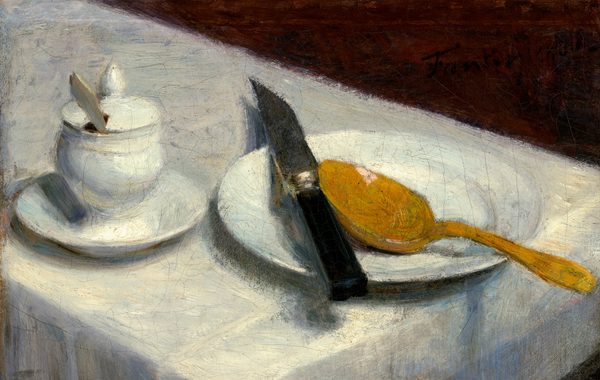 We look down at the end of a narrow table at a white plate, pot, knife, and spoon set on the white tablecloth in this horizontal still life painting. The table angles from the top left down into the bottom right of the composition, and the corners of the table itself are cut off by the right and bottom edges of the canvas. At the left, a white ceramic vessel with a lid topped by a teardrop-shaped knob sits on a white saucer. The lid is notched and the handle of a utensil sticks out. To the right, a round white plate rests partly off the edge of the table. On the plate is a golden-yellow spoon positioned with its handle extending to the lower right. A black-handled knife lies across the rims of the plate, its dark blade angled upright and casting a long shadow behind it. The triangular slice of background above the tablecloth is a deep reddish brown. The brushstrokes are visible throughout the painting, and the surface has fine cracks.