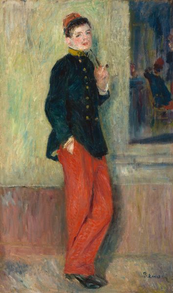 This painting shows the full body of a person leaning against a wall. The person is standing with one hand in their pocket and the other holding a thin brown pipe near their mouth, their body turned to the right, their head facing us. They have fair skin and short dark hair under a small red cap. The person is wearing a dark coat with gold buttons and bright red pants. The coat has a high yellow collar. The background consists of muted green tones with a stripe of brown at the bottom, perhaps suggesting a wall with wainscoting. In the top right corner are dark blue and reddish forms that seem to indicate either a piece of art or a window that shows objects or people. The brushstrokes in the painting are visible, giving the scene a fuzzy appearance.