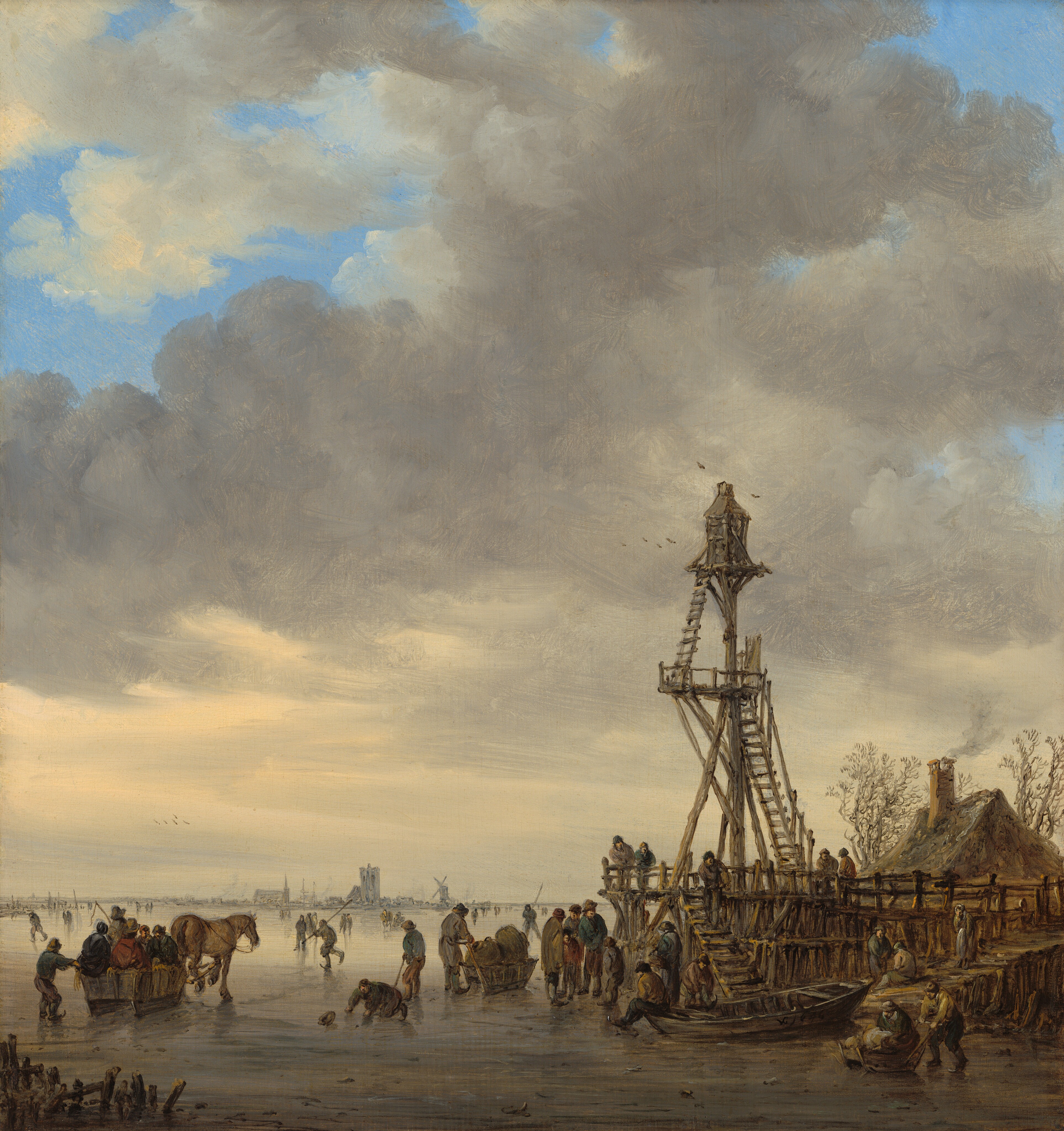A band of gray ice spans the bottom quarter of this vertical landscape painting, where dozens of people stand, skate, ride in sledges, or cluster near a slender wooden tower, all beneath a vivid blue sky screened with towering gray clouds. We look slightly down onto the scene from a distance. The cloud bank is horizontally streaked with pale yellow light along the bottom, but swells into gray puffs that break apart in several places toward the top to reveal patches of blue sky. The people below wear heavy coats, hats, and trousers, mostly in muted slate blue, gray, and brown. Many have their backs to us. Closest to us and near the lower left corner of the painting, a rectangular wooden sledge on rail-like runners holds five or six passengers, and is pulled by a brown horse toward the center distance. Nearby, a man on his hands and knees scrambles for his fallen hat. A man holds a pole like a hockey stick behind him, looking into the distance where others stand or run with more sticks. Near the bottom center of the painting, a man pushes a sledge laden with two brown bundles. The largest group of people and children gather on and around a rickety wooden pier from which the tower rises, to our right of center. A lantern-like structure sits atop a narrow platform on a tall pole, at the top of the tower. One ladder leads up to a landing about two-thirds of the way up the pole, and another leads to the top. A house with a pitched roof and smoking chimney sits on the far side of the pier, between two bare trees with curling, twisting branches. Birds fly above the tower. The ice is dark gray closest to us, and it becomes paler as it recedes into the distance. People dot the ice singly and in small groups as far as the eye can see. Far away, the silhouettes of a church with a spire, the masts of two ships, a wide tower, and a windmill line the horizon. The artist signed the work with a monogram and a date as if painted on the boat in the lower right corner: “VG 1646.”