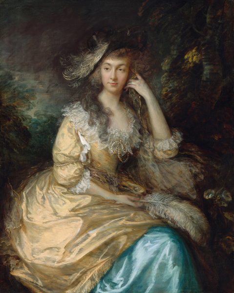 Shown from the knees up, a woman sits looking off into the distance in front of a deep, shadowy landscape in this vertical portrait painting. The woman’s body is angled slightly to our right, but she turns her oval face to the left to gaze off with brown eyes. Her upper lip is thin, and her lower lip is fuller. A cloud of ash-brown curls frames her face, and long locks fall over her shoulders. Her wide-brimmed black hat is set at a steep angle to our left. The hat has a white feather lying along the front edge and a pearl hanging from the top front of the brim. Her butter-yellow gown has translucent white ruffles along the low, scooped neckline and a strand of pearls tied at in a bow at the front of the chest. The puffy sleeves come just past the elbows and are similarly lined with ruffles and encircled with pearls. The overskirt drapes over a topaz-blue underskirt. The woman holds a feather in the hand resting in her lap. Her left elbow, to our right, is propped on a stone and that hand holds a gold-colored scarf up by her face. Deeply shaded trees and a murky blue sky fill the background. The portrait is loosely painted in the clothing and background.