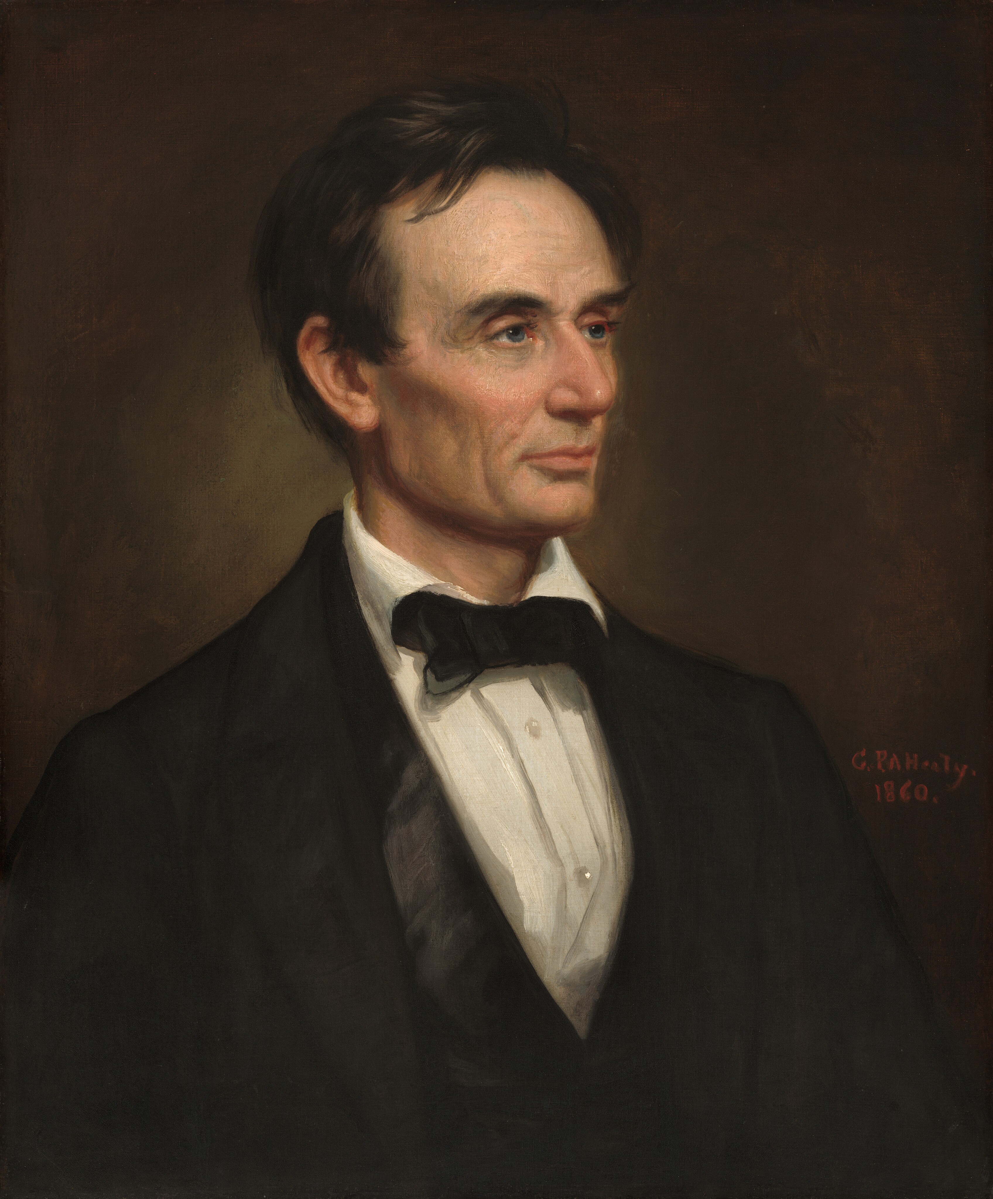 The head and shoulders of a cleanshaven, light-skinned man with black hair and a lined face is shown against a dark background in this vertical portrait. His body is angled to our right and he looks in that direction with blue-gray eyes under black brows. His hair is combed loosely back from his face but one lock falls onto his forehead, and it curls around the ear we can see. His prominent cheekbones are lightly flushed over hollow cheeks, which create noticeable shadows. He has a long nose, and his thin pink lips are closed. His forehead, the corners of his eyes, and the areas around his mouth and chin are lined with wrinkles. His black suit jacket has wide rounded lapels over a white buttoned shirt. The collar folds over a black bow tie and the two buttons visible on this shirt shine. Next to his left shoulder, on our right, the artist signed and dated the work with red paint: “G.P.A. Healy 1860.”
