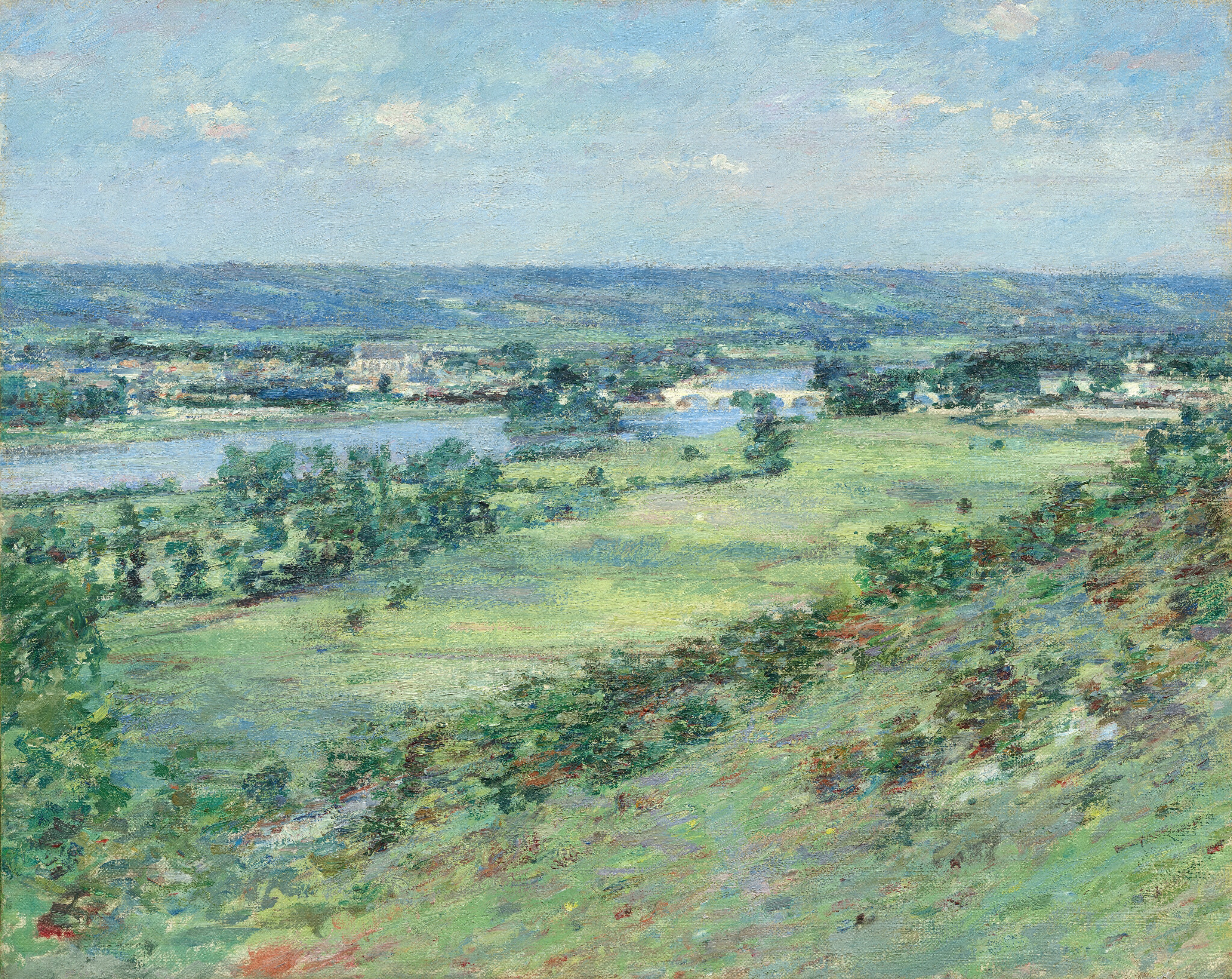 From atop a high hill, we look across a broad valley leading to a winding river in this loosely painted horizontal landscape. The scene is created entirely with visible brushstrokes in fresh and vibrant green and shimmering and smoky blues. The hill slopes from the right edge of the painting down to the valley, which extends into the distance, angling slightly to our right alongside the river. Darker green trees are along both sides of the river, and a few buildings line the far bank. The land beyond rises to sapphire-blue hills along the horizon, which comes about two-thirds of the way up the composition. A few white clouds dot the robin’s egg-blue sky above.