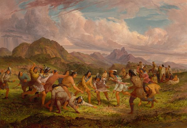 This painting shows a scene with people engaged in a sport or game. The people wear vibrant clothes in shades of brown, orange, yellow, pink, and green, embellished with feathers and silver jewelry. The people all have light brown skin and long dark hair, and many of them have feathers in their hair. All the people in the middle of the painting hold sticks with small nets at the end, and they all appear to be lunging towards a small ball on the ground. In the background is a dramatic landscape with tall purple mountains, green hills, and large pink-and-white clouds sweeping across the blue sky.