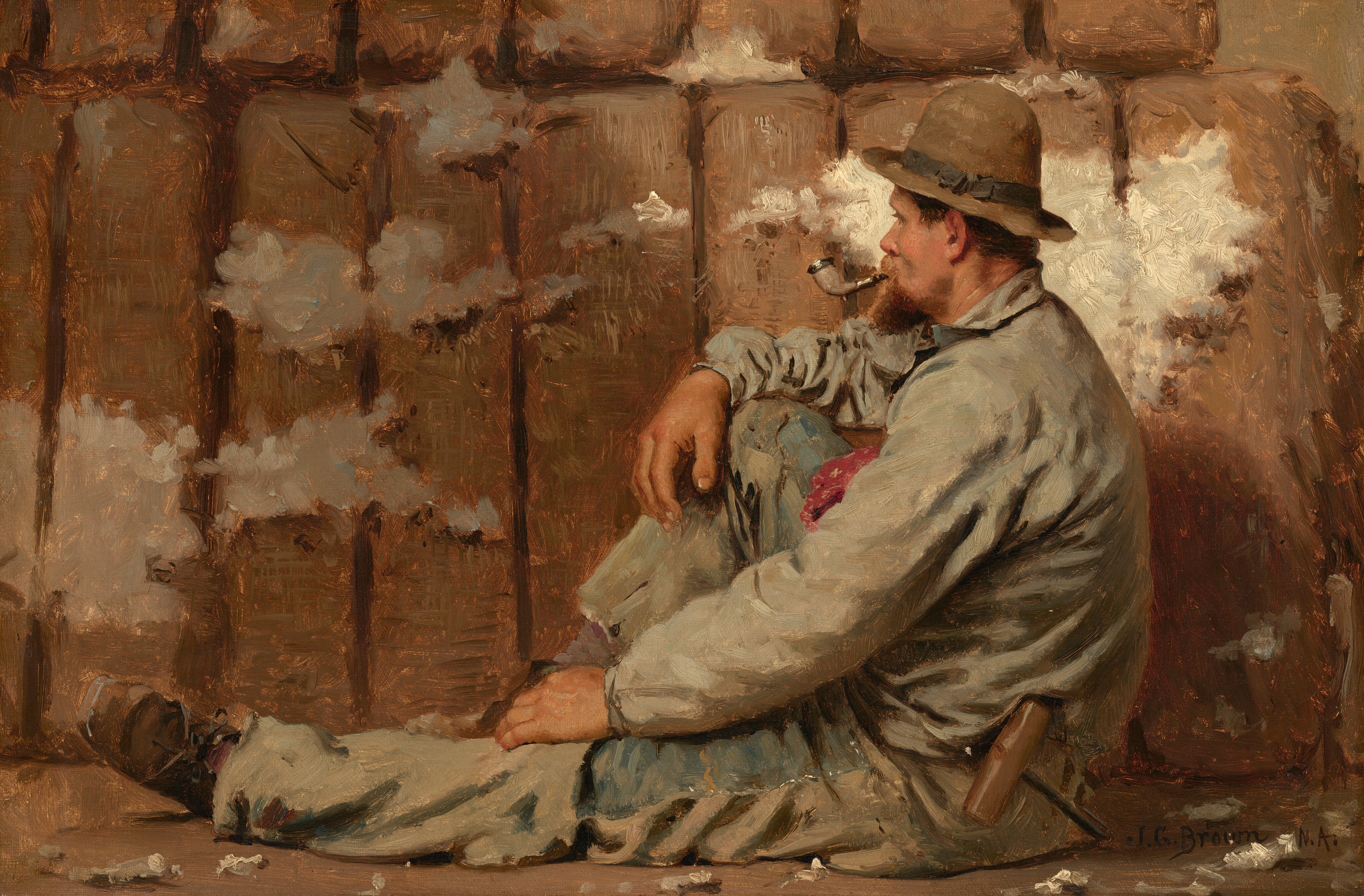 In this painting, there is a man seated on the ground, one leg bent and one left stretched in front of him, facing the left. He sits in front of what looks like a stack of cotton bales, with fluffy white material peeking out of brown fabric. The man has peach-colored skin and a short brown beard, and his hair is obscured by a tan hat with a black ribbon. He wears a long-sleeved light blue shirt and light blue trousers, with a patch of red on his chest - perhaps a handkerchief in a breast pocket. His arms rest on his legs, and he has on dark brown boots. He has a white-and-silver pipe in his mouth and a wooden mallet or hammer tucked into his belt. The wall behind the brown bales is a brownish-gray color, and the floor beneath the man is brown, and scattered with white tufts.