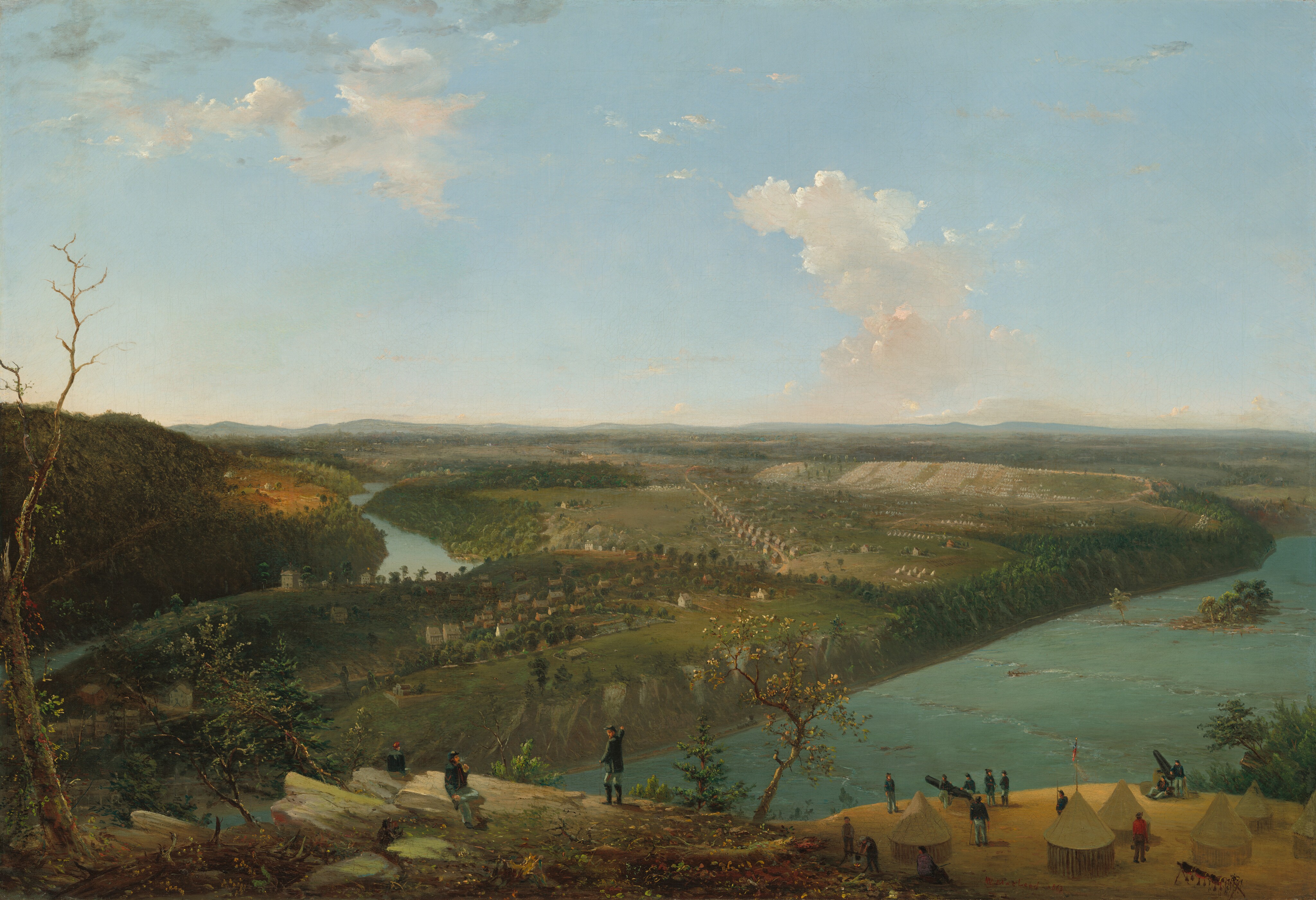 This horizontal landscape painting shows a panoramic view of a river valley and an encampment from an elevated vantage point. The horizon runs about halfway up the composition beneath a wide expanse of pale blue sky dotted with a few puffy white clouds. A rocky bluff runs along the bottom edge of the canvas, closest to us. Three people in uniforms of dark blue jackets and lighter blue pants sit or stand among the sparce trees and shrubs there. One faces away from us, one sits on a boulder and smokes a pipe, and one gestures across the river. On a flat surface a bit farther down and to the right, more people stand among six white tents. Some tend to two cannons aimed across the river, which creates a hairpin turn in the lower left corner of the composition. The wide river feeds the turn to the right and the waterway continues to the horizon to the left. What first appears to be gentle rapids on the river could be two canoes rowed by several people each. On the far side of the river are a town with buildings set loosely within a block and a road traveling into the distance, which is also lined with houses and buildings. To the right of this are a few clusters of white tents leading back to rows of countless white tents on a gently rolling hill in the distance. The tents and hills become hazy as they approach the horizon. Two piles of cream-white clouds drift across the pale blue sky above.