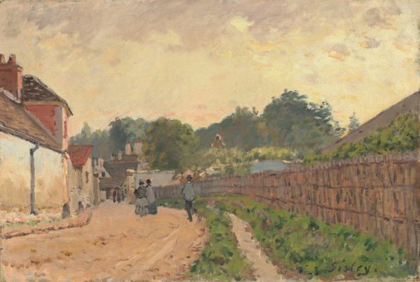 This painting depicts a street scene from a slightly elevated perspective. A tan dirt road stretches into the distance, lined with white houses on the left side. On the right side is a tall fence, and behind it the green tops of trees or bushes are visible. People in dark clothing walk along the street in the distance. Beyond them, taller trees are visible, with more buildings below them. The sky above is softly colored in hues of yellow, peach, and gray. The brushstrokes are loose and visible.