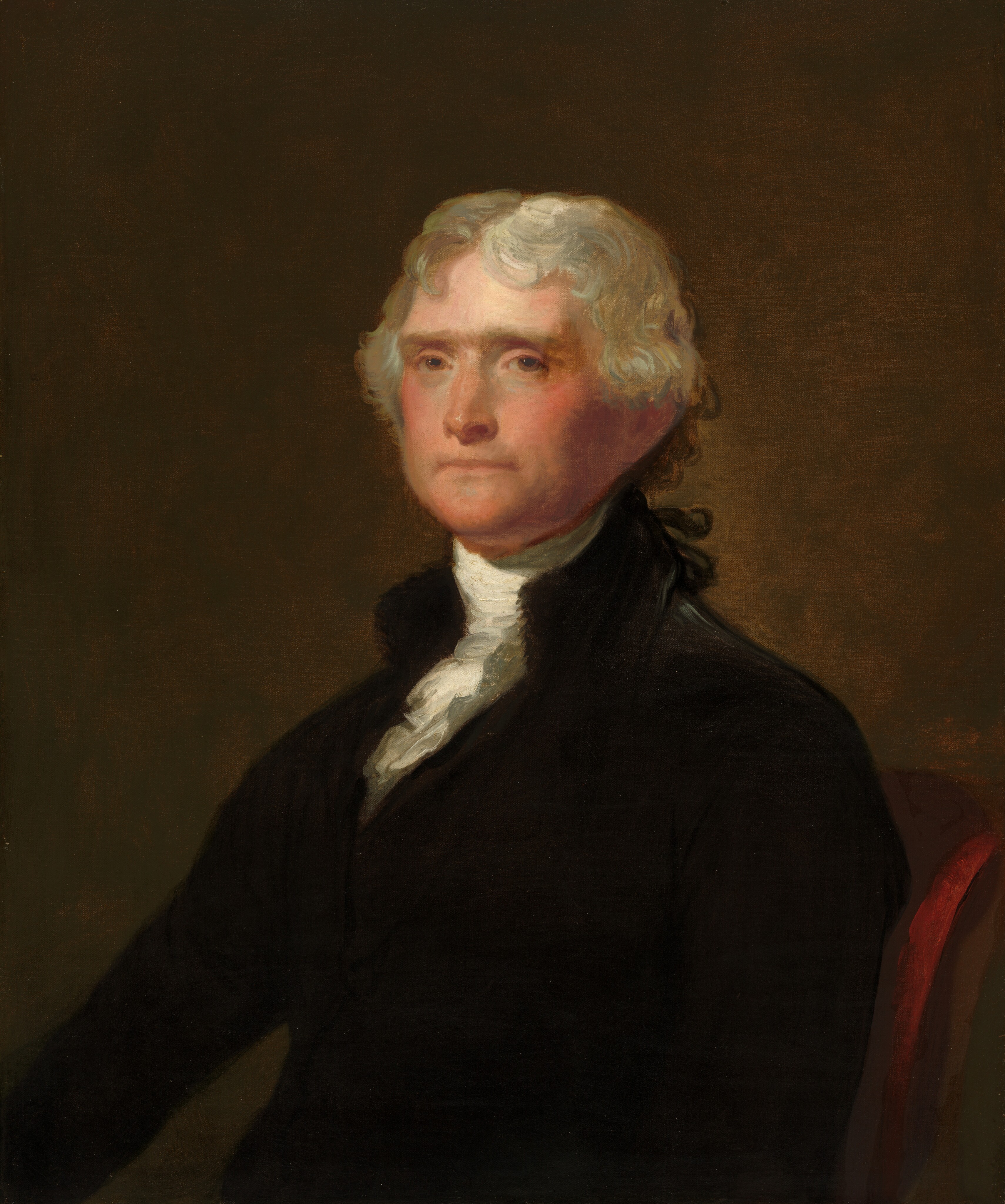 This painting is a portrait of a seated man, seen from the waist up. The man's torso is turned slightly to the left, with his head turned to look at us. He has pale skin with high cheekbones, straight eyebrows, and thin lips set in a neutral expression. His hair is gray and appears to be tied in a low ponytail behind his head, with some curls around his ears. He is wearing a dark coat over a white shirt with a high collar. The background is blur of brown, and the chair he sits on is dark red.