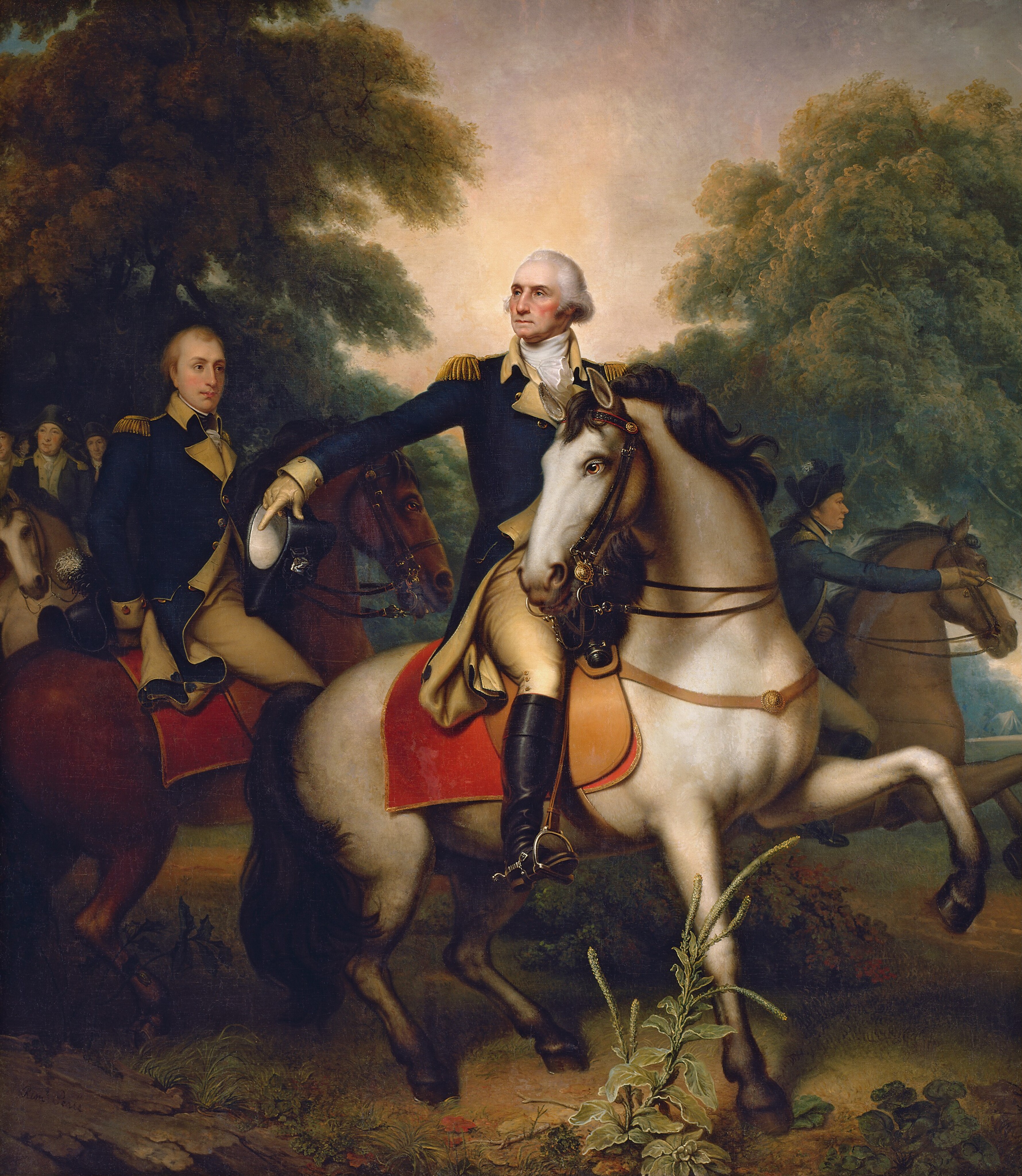 A man wearing a military uniform and riding a horse gestures in front of a small band of soldiers in this vertical painting. All the men have pale skin and wear navy-blue and flax-yellow uniforms. The central man, George Washington, and the cream-white horse he rides take up most of the composition. The horse has a glossy black mane and tail, and black hooves. The horse stands with its body facing our right in profile, one front leg lifted, but it turns its head to look off to our left with clear brown eyes. There is a scarlet-red blanket under the fawn-brown saddle. Washington also turns his head to our left to look up and off in that direction. He has a high forehead, a beaked nose, and his thin pink lips are pressed in a line. He has ruddy cheeks, a dimpled chin, and jowls along his jawline. His white hair is streaked with gray, and it sweeps back from his high forehead and bushes out over each ear. His blue jacket has gold epaulets, a high yellow collar around a white neckerchief, and gold-colored buttons down the front. The uniform also has yellow lapels, cuffs, and knee-high britches. The toe of his knee-high black boots pushes against the horse’s stirrup. Washington holds his right arm, to our left, out and points down with a gloved hand, which also holds a black, tricorn hat. The nearest man, just behind Washington to our left, rides a chestnut-brown horse. He is cleanshaven with blond hair, and looks at Washington, one hand tucked behind his lower back, where his hat rests on the horse’s rump. Several more men ride together under a grove of trees to our left, and the final rider lurches forward on a horse whose two front legs are raised midstride, to our right of Washington. The dirt ground beneath has some scrubby grass and a few plants. Tall, leafy green trees stretch to the sky to either side of the painting. The artist signed the painting in the lower left corner, on a rock. It reads, “Remt. Peale.”