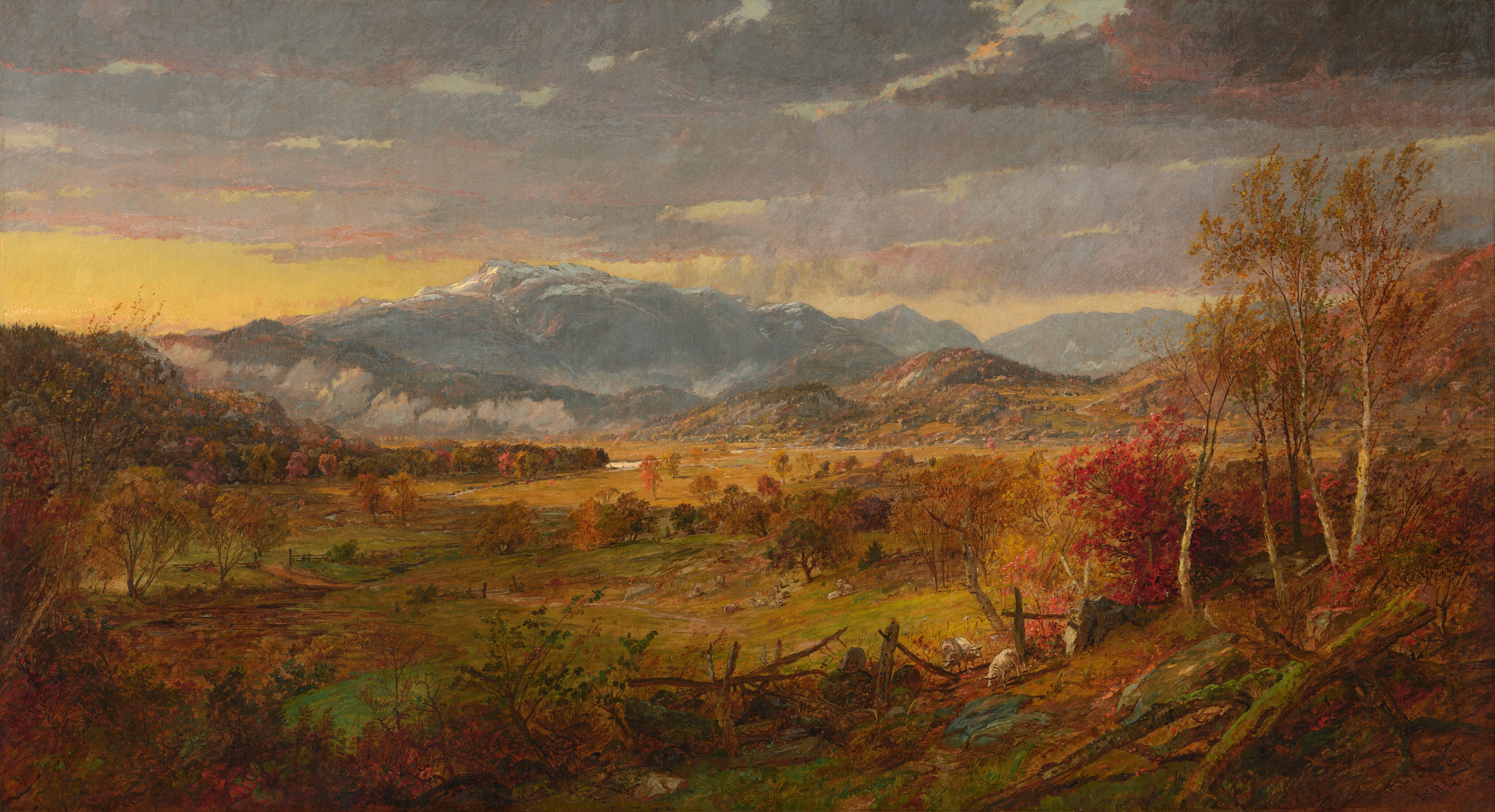 This painting shows a landscape with tall, blue, snow-capped mountains in the distance. There are blue and purple clouds in the yellow sky. Closest to us is a tree-lined field covered in autumnal colors, including reds, oranges, yellows, and light greens in the trees and grass. Small white sheep graze on rolling hills leading to the mountains in the distance.