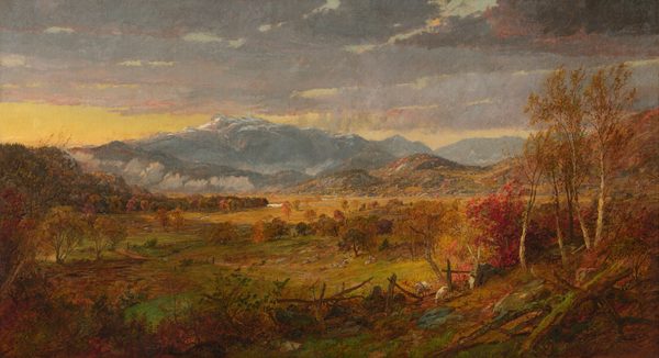 This painting shows a landscape with tall, blue, snow-capped mountains in the distance. There are blue and purple clouds in the yellow sky. Closest to us is a tree-lined field covered in autumnal colors, including reds, oranges, yellows, and light greens in the trees and grass. Small white sheep graze on rolling hills leading to the mountains in the distance.
