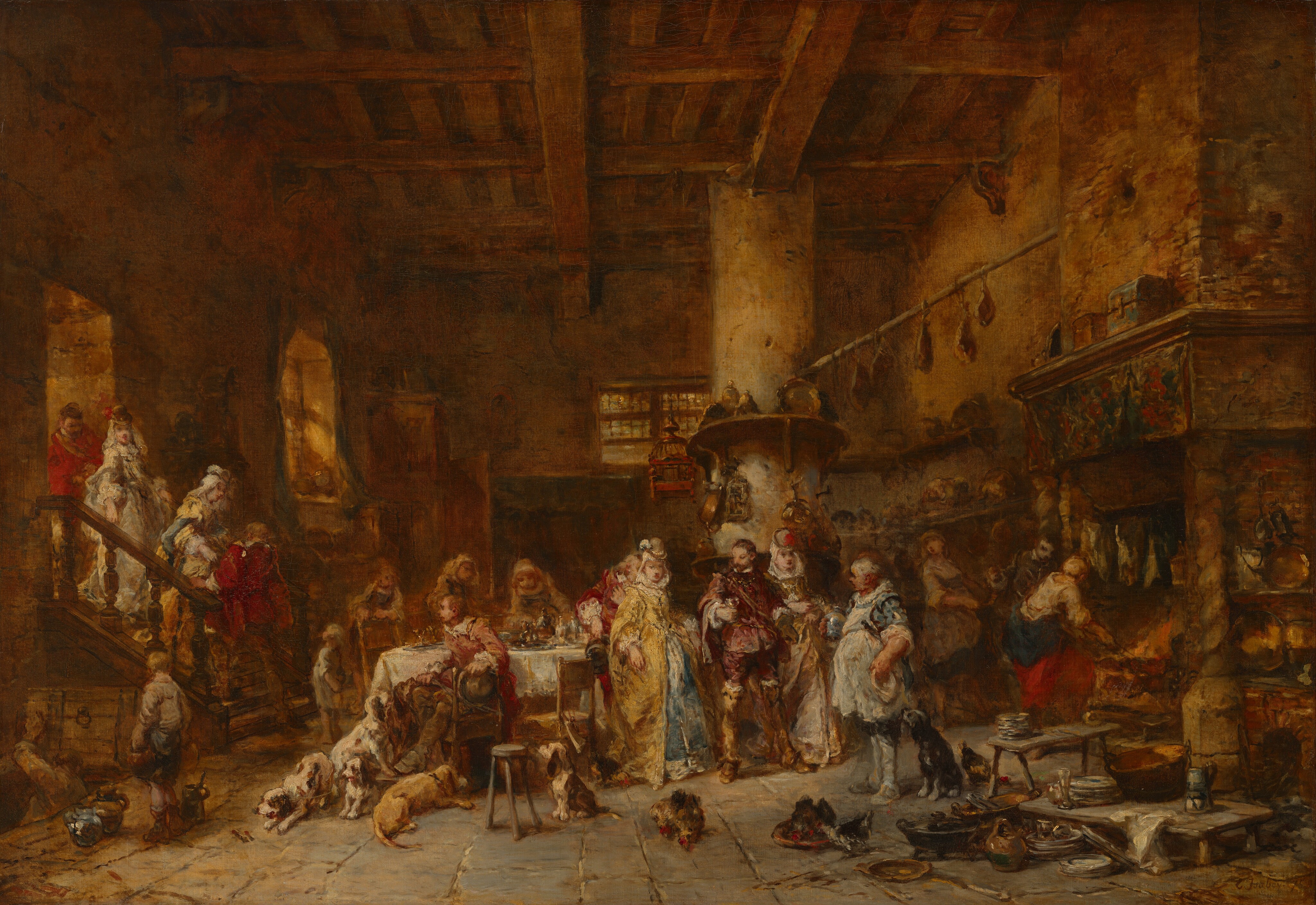 This is a painting of a busy domestic kitchen scene in the style of Jan Steen. The room has a high-beamed ceiling and stone floor, with a large dining table at the center where food is being served. Several figures are engaged in conversation and dining around the table. To the left, a group is descending a wooden staircase, and in the foreground, there are dogs and a cat. A large fireplace dominates the right side of the room, stacked with cooking utensils and pots. Various food items hang from the ceiling, and the room has a warm, golden-brown color palette, creating a welcoming ambiance.