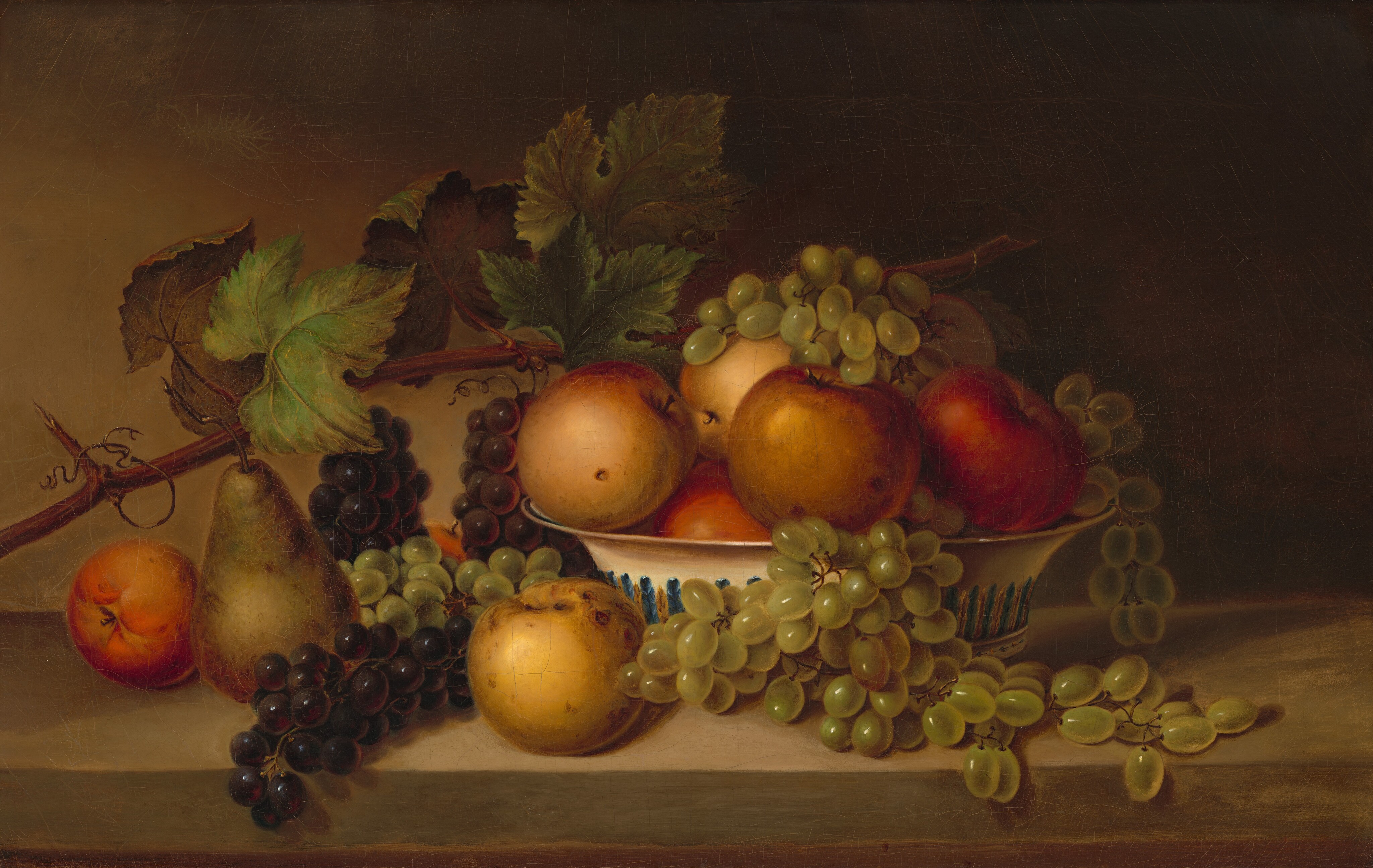 This painting shows a still life arrangement with a white-and-blue striped bowl filled with apples and grapes, surrounded by additional fruits, including a pear. The bowl and fruit rest on a flat brown surface. The color palette consists of warm tones of red, yellow, and pink from the apples, while green and dark purple hues come from the grapes and pear. A vine with large green leaves extends above and behind the arrangement, coming from the left. The wall in the background is dark brown.