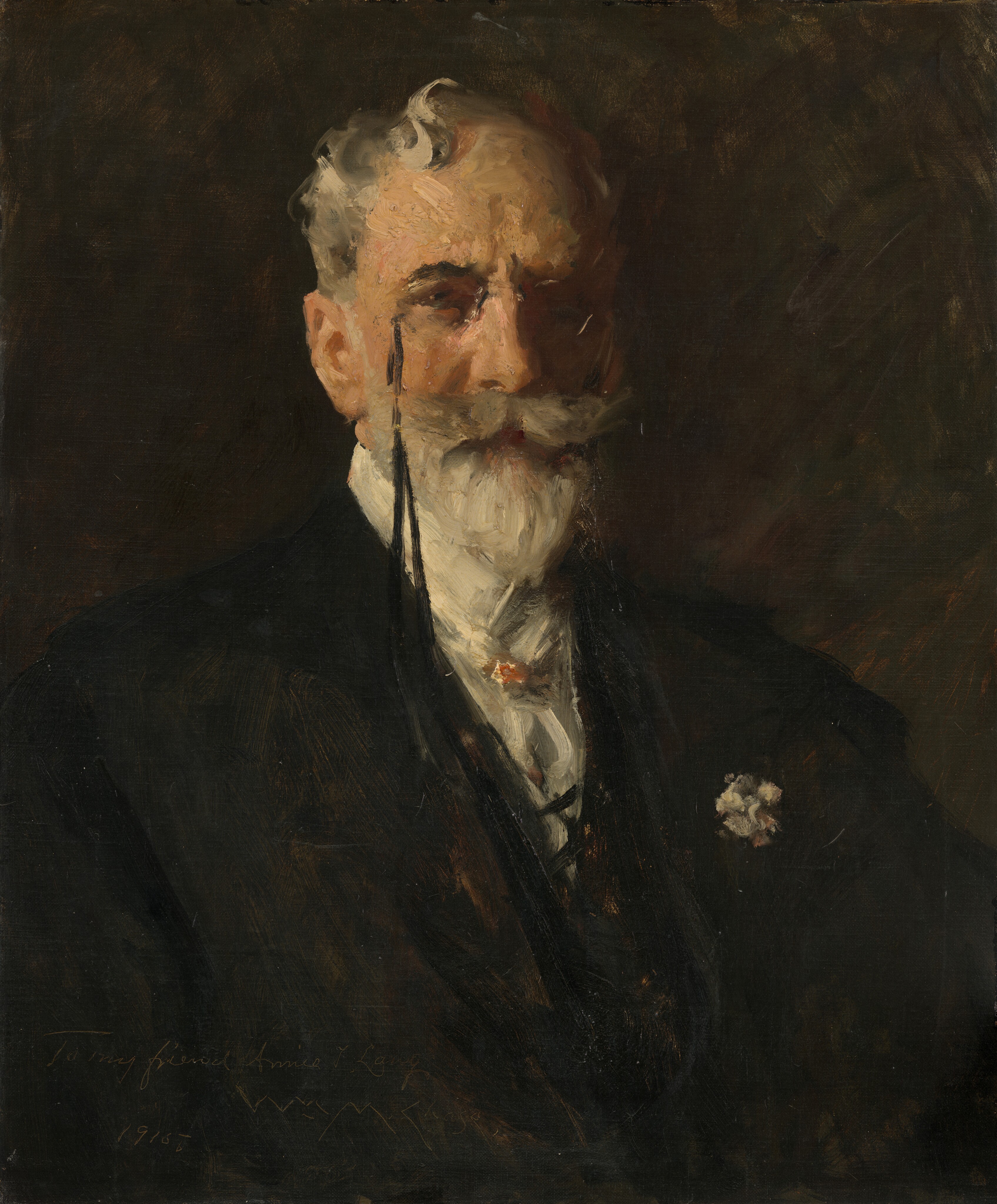 This painting depicts a man from the waist up, facing us. He has light skin with a curled white mustache and pointed beard, and gray, wavy hair. Glasses rest on his nose, attached to a long black string that appears to be tucked into his vest. The right half of his face is in shadow. He is wearing a dark suit with a white shirt and a white flower pinned to his lapel. The background is dark, and the edges of his body and clothes blur into it. The painting style is loose, with visible brushstrokes.