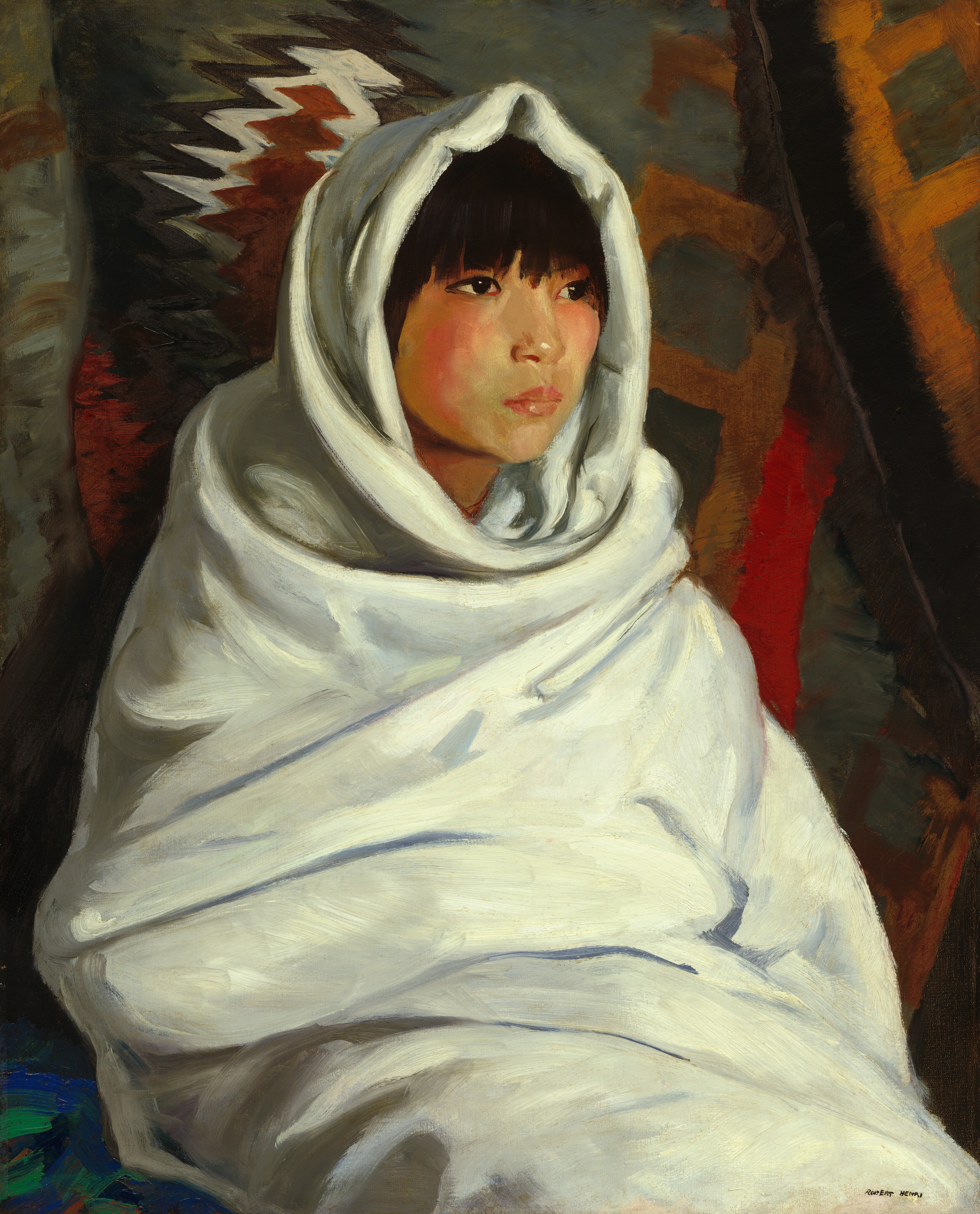The painting displays the upper torso, head, and shoulders of a person wrapped in a light-colored fabric that covers their body and forms a hood around their head. The person appears to be seated, facing slightly towards the right. They have fair skin with rosy cheeks, full, pink lips, dark eyes, and straight black hair cut into bangs that cover their eyebrows. The background appears to be a gray fabric covered with geometric shapes in red, brown, orange, and white tones.