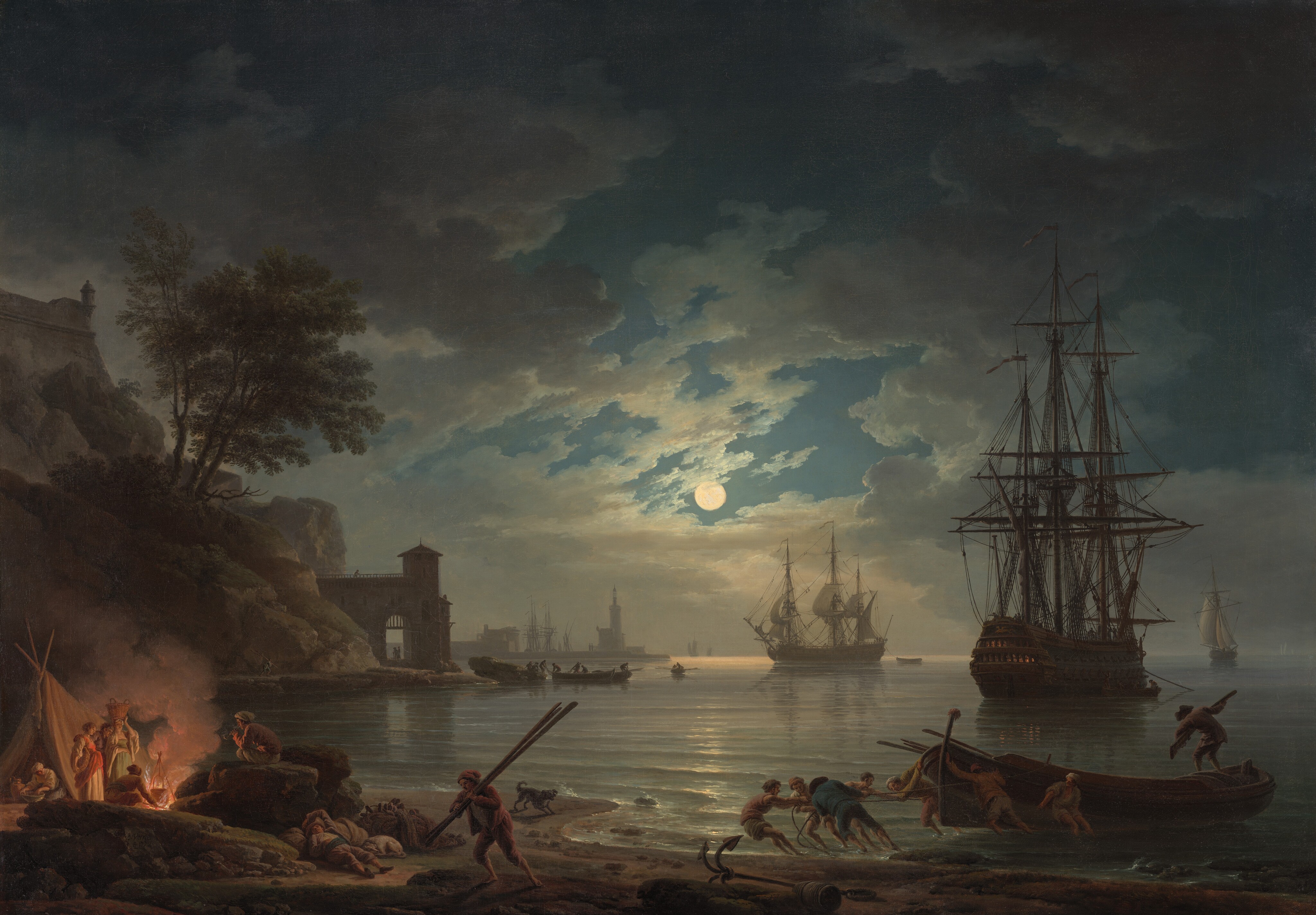 Moonlight falls across several masted ships near a rocky shoreline in this horizontal painting. The sky fills the top three-quarters of the picture. A veil of slate-gray clouds is lit to pearl white around the crisp, full moon at the center of the composition. Patches of denim-blue sky are seen through breaks in the blanket of clouds. Moonlight reflects down the center of rippling, silvery-gray water that laps against a beach close to us, along the bottom edge of the painting. A tent is set up in the lower left corner of the composition. There, two women and one man stand looking at a glowing fire next to the tent. One woman holds a basket on her head, the other tucks a flat basket under one arm. The man stands between the two women, and a fourth man crouches near the fire, his back to us. In the opening of the tent, another woman kneels over a large bowl as she looks at the fire. A fifth person, a man, gazes at the fire as he sits smoking a long-stemmed pipe on a boulder. At the foot of the boulders, a man lies back against some bundles, one arm thrown up over his head. A dog curls up next to his hip. Not far from the sleeping man and in the center of the foreground, a man carries several long wooden objects, possibly oars, over one shoulder while a dog beyond him barks at the lapping surf. The beach curves like a C away from us, along the left. At the point of the curve in the middle distance, a structure like a city wall and gate jut out to the water’s edge. More buildings atop steep cliffs rise vertically beyond the gate. The shoreline curves into the distance again, and more buildings, including a lighthouse, and masted ships there are smoke-gray silhouettes. Near the lower right corner of the painting, four men pull on ropes tied around the prow of a small wooden boat while three others push it toward the land. Another man stands in the far end. A short distance beyond that boat is a tall wooden ship with three masts and rigging outlined against the night sky. Windows along the decks of that boat’s wide stern, angled toward us, glow with golden light. Beyond it and a bit to our left, another ship, smaller in scale, sails away from us. Several more ships move back to the horizon until we only see strokes of white and gray to indicate their unfurled sails.