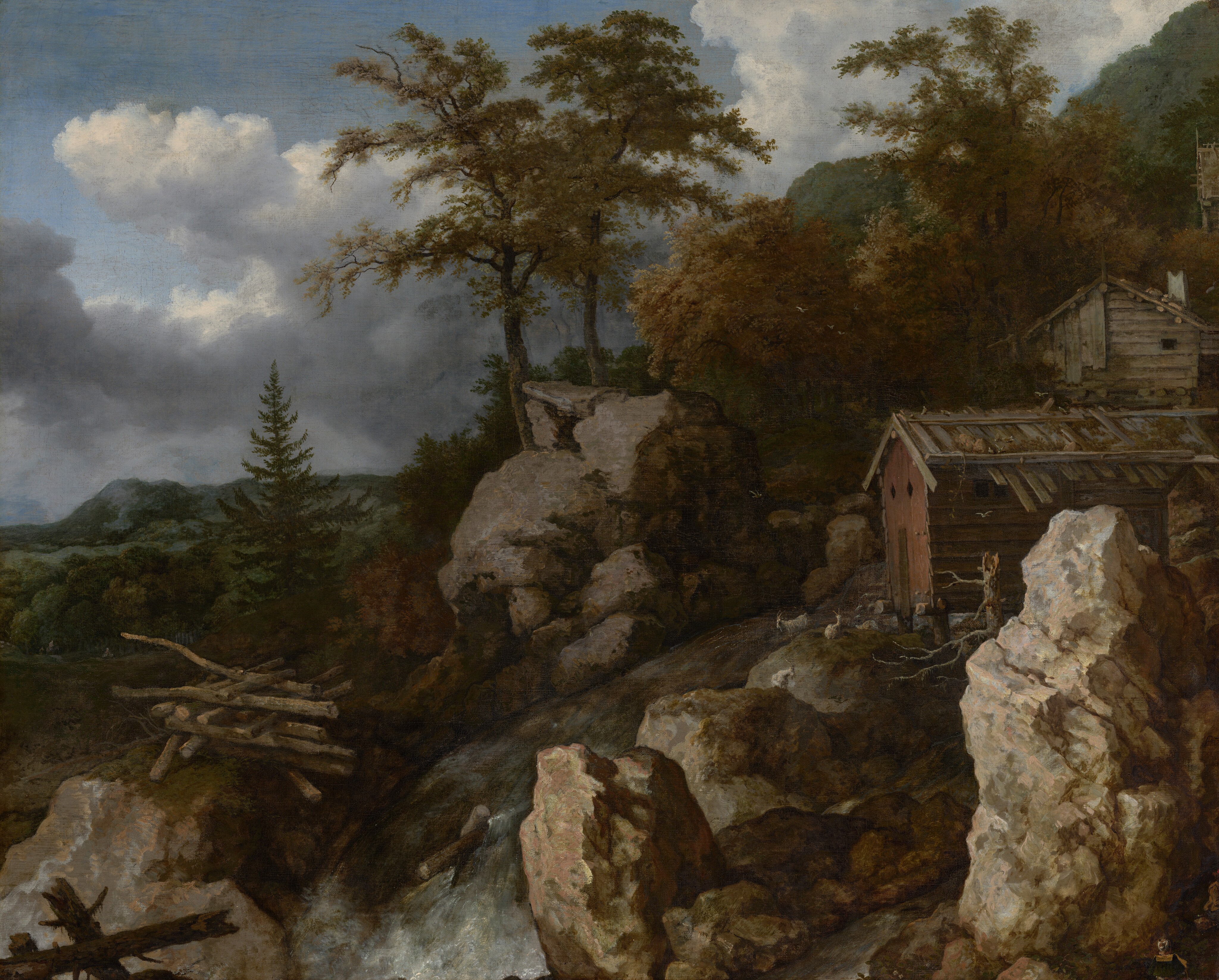 This painting shows a landscape with rugged gray rocks, rolling green hills, and tall trees with leaves in shades of dark green and rusty orange. On the left, red and gray wooden structures sit on the rocky ground, surrounded by scattered rocks and tree limbs. Small white goats walk on the rocks around the buildings. A gray river flows from near the buildings down to a waterfall at the center of the painting. The sky above is light blue and covered with white and gray clouds.