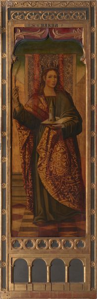This image shows a woman standing upright, facing the viewer. She has long wavy hair and is dressed in a robe with intricate patterns in red and gold over a green garment. She wears a golden crown and holds a white feather in her right hand and supports a small tower on an open book in her left hand. The background features ornamental design and the painting is in a decorative wooden frame. Above her head is an inscription that reads "SANTA BARBA."