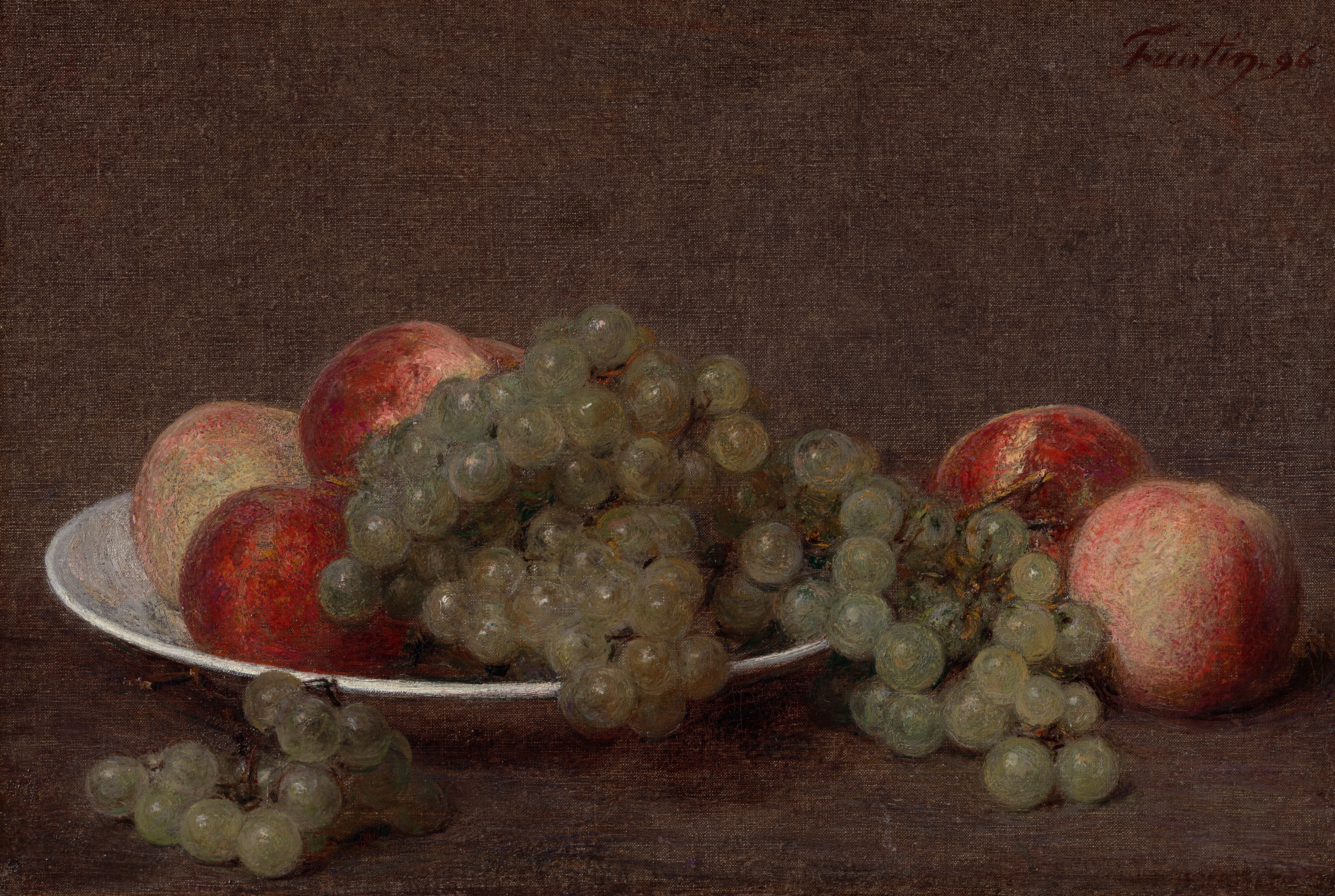 The image shows a still life of round fruits, such as grapes and peaches, placed on a white plate. The color scheme consists of warm browns, muted greens, and deep reds. The fruits have a natural sheen. Positioned on the left center, the plate is filled with grapes spilling over its edge, with peaches of different shades scattered around. The background and support surface are dark brown, contrasting with the colorful fruit.