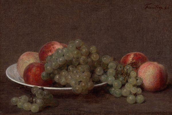 The image shows a still life of round fruits, such as grapes and peaches, placed on a white plate. The color scheme consists of warm browns, muted greens, and deep reds. The fruits have a natural sheen. Positioned on the left center, the plate is filled with grapes spilling over its edge, with peaches of different shades scattered around. The background and support surface are dark brown, contrasting with the colorful fruit.