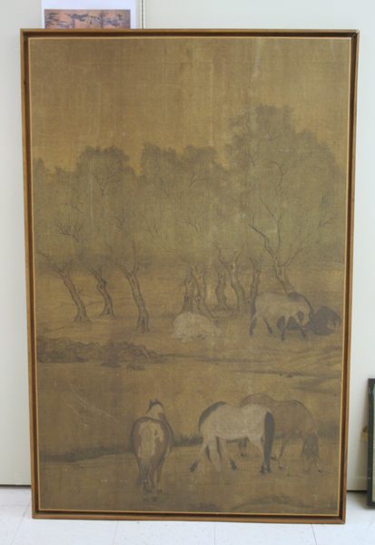 A work made of ink and light color on silk.