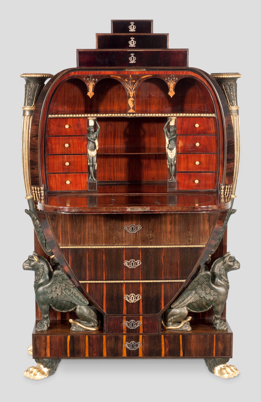 Wooden fold-out desk with many drawers, two gryphons perched at bottom.