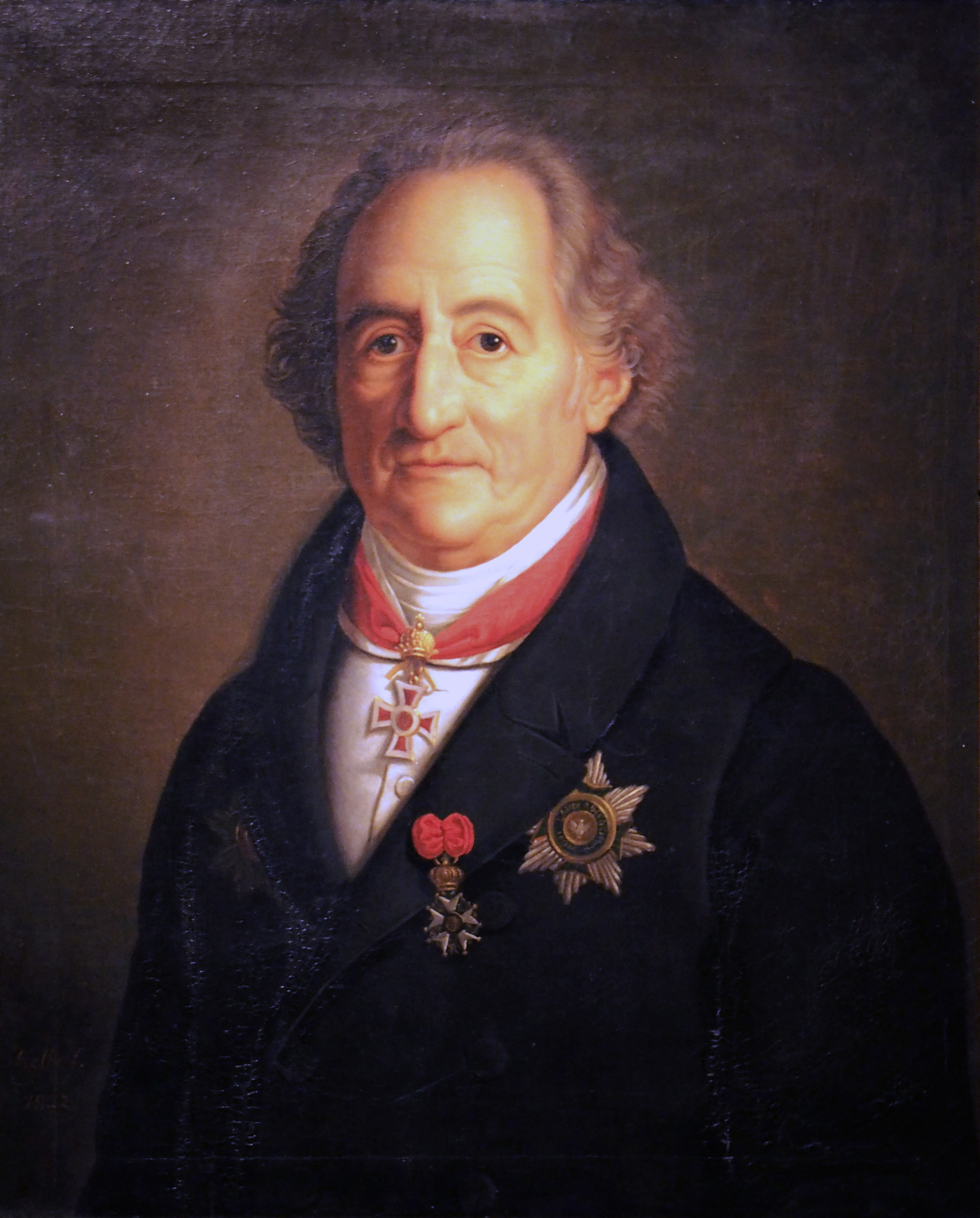 Goethe:Am roten Band um den Hals trägt er das Komturkreuz des Österreichisch-Kaiserlichen Leopoldordens, an der linken Brust das Offizierskreuz der Französischen Ehrenlegion und den Bruststern zum Großkreuz des Sachsen-Weimarschen Hausordens der Wachsamkeit. by Heinrich Christoph Kolbe