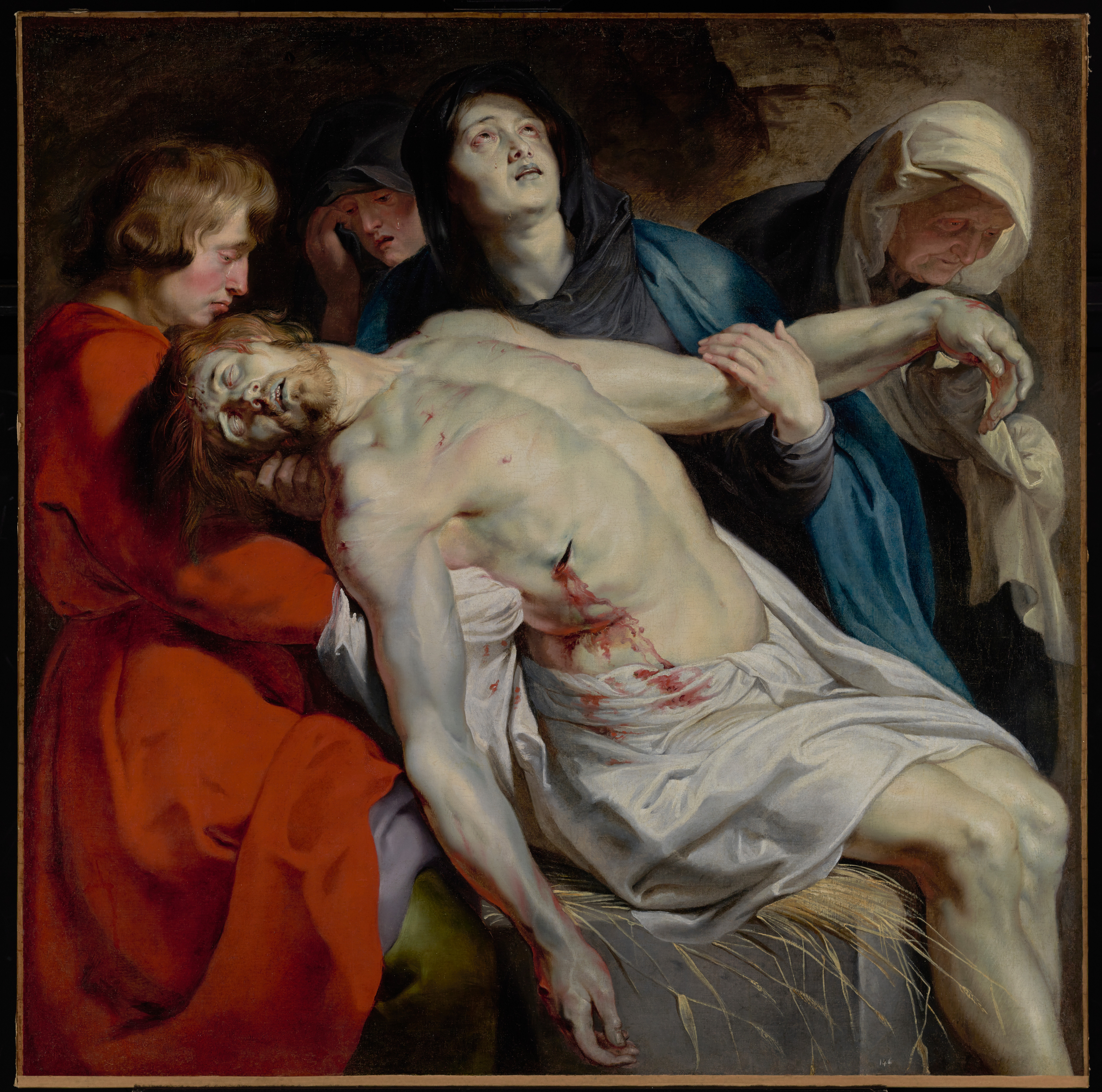 Rubens: mourners supporting the pale body of Christ in a tightly grouped religious scene.