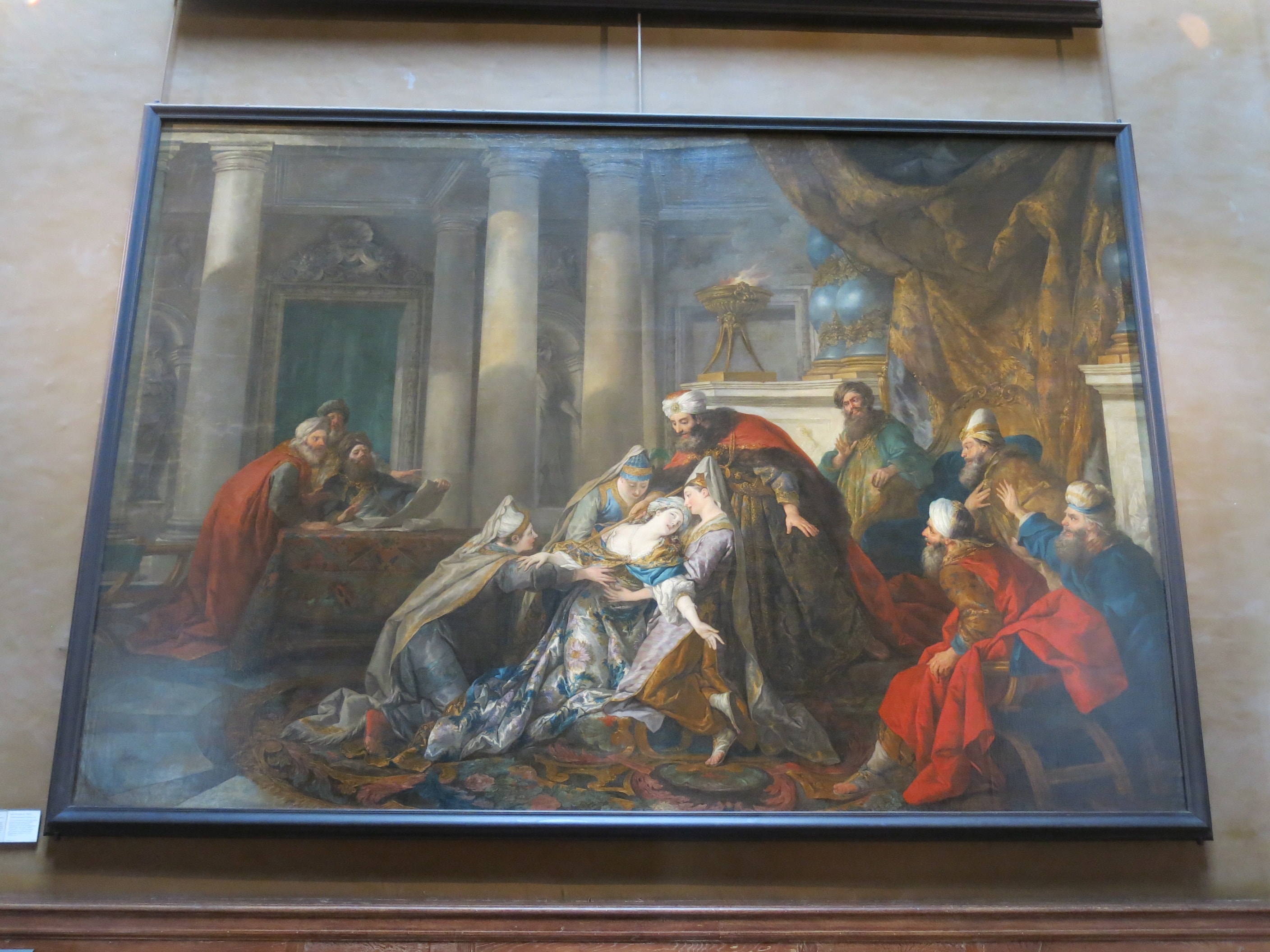 Esther vanishing. In seeking to save the Jews from extermination, Esther violated the ban of entering into the Royal Palace. She faints. The king puts his scepter on the breast of his wife as sign of absolution. by Jean-François de Troy
