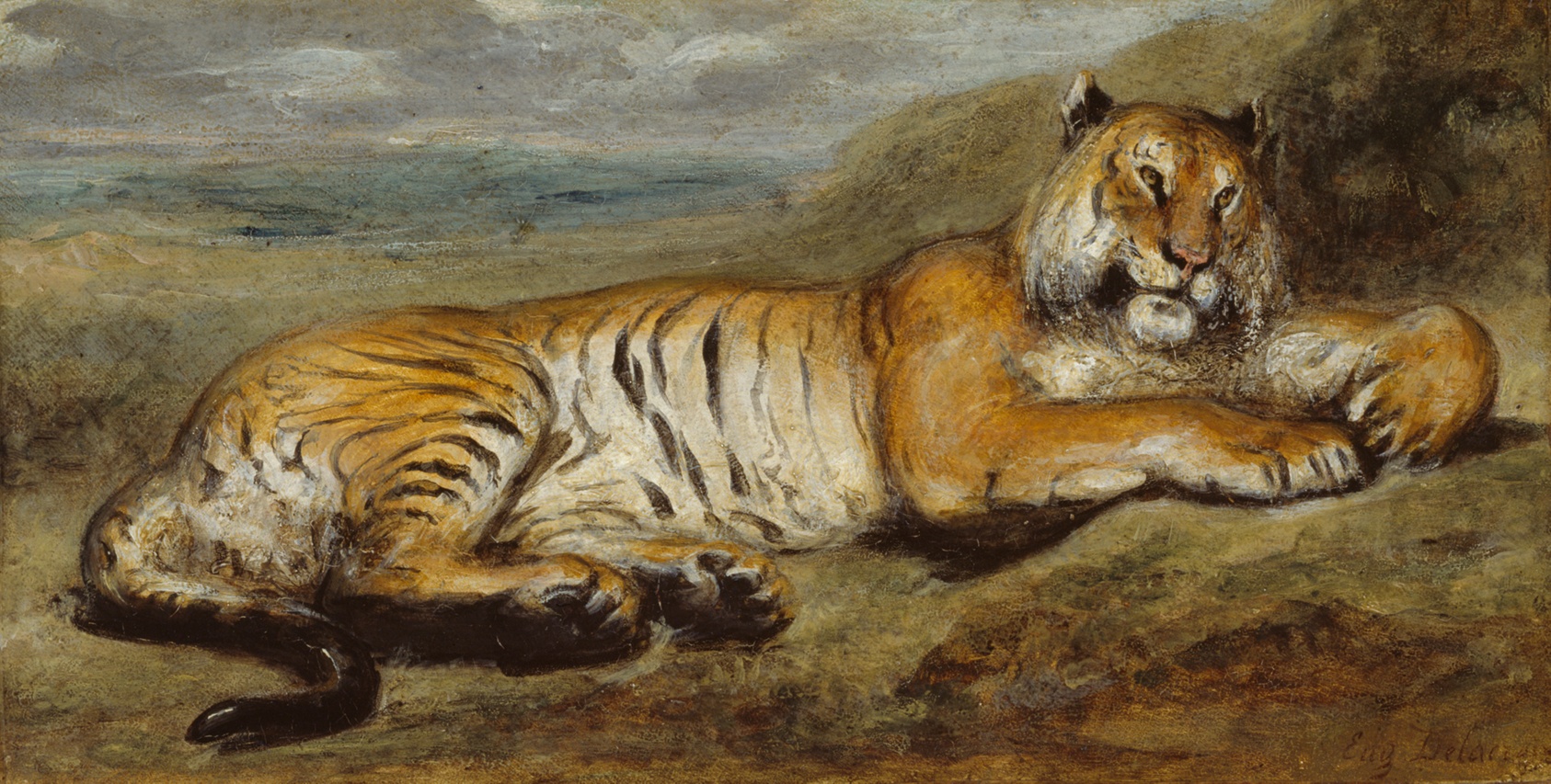 A boldly painted orange tiger lies on brown, rocky ground, his body nearly filling the canvas, blue water and gray sky in the background.